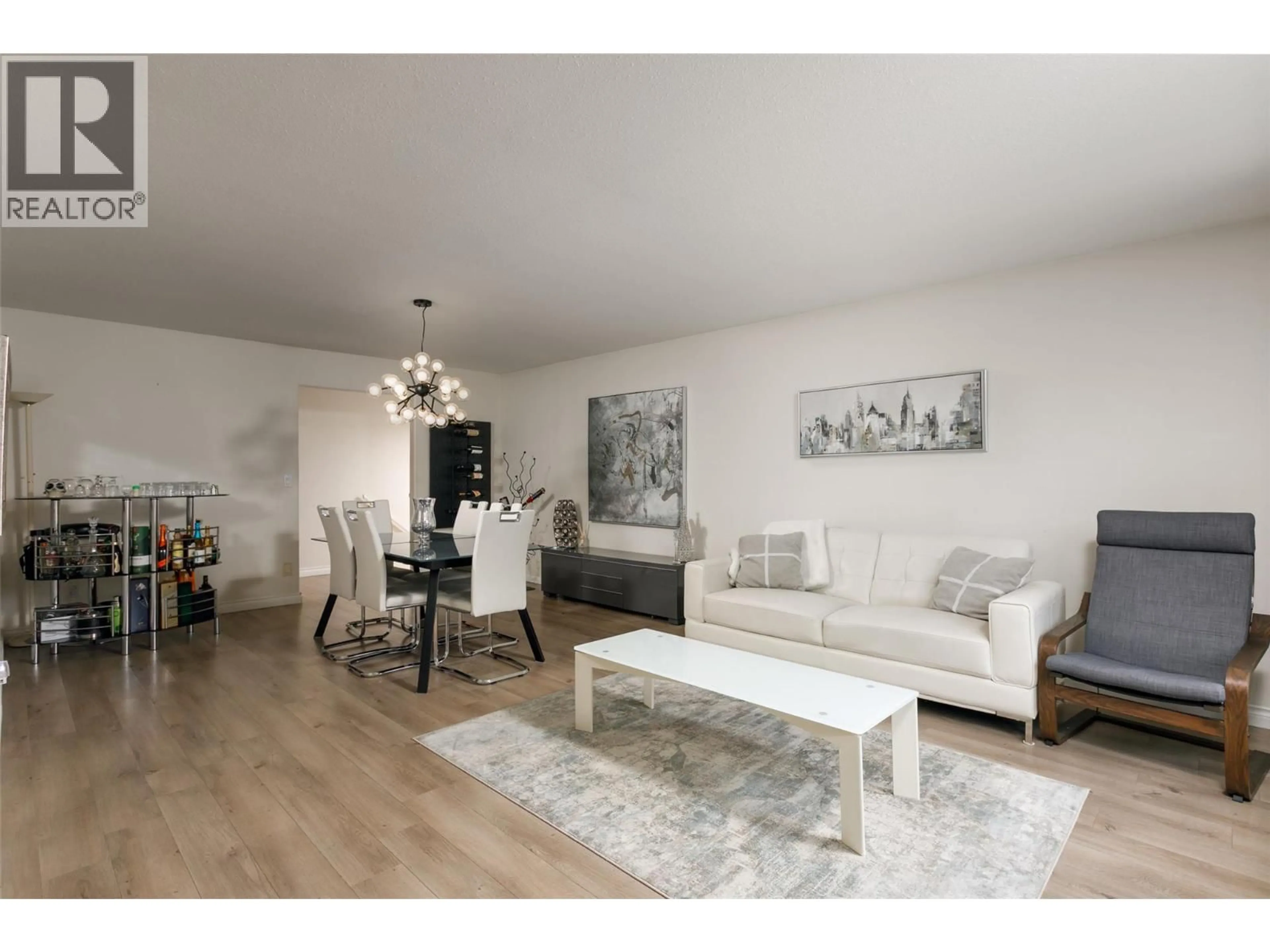 Living room with furniture, wood/laminate floor for 2611 GUIDI ROAD, West Kelowna British Columbia V1Z3J9