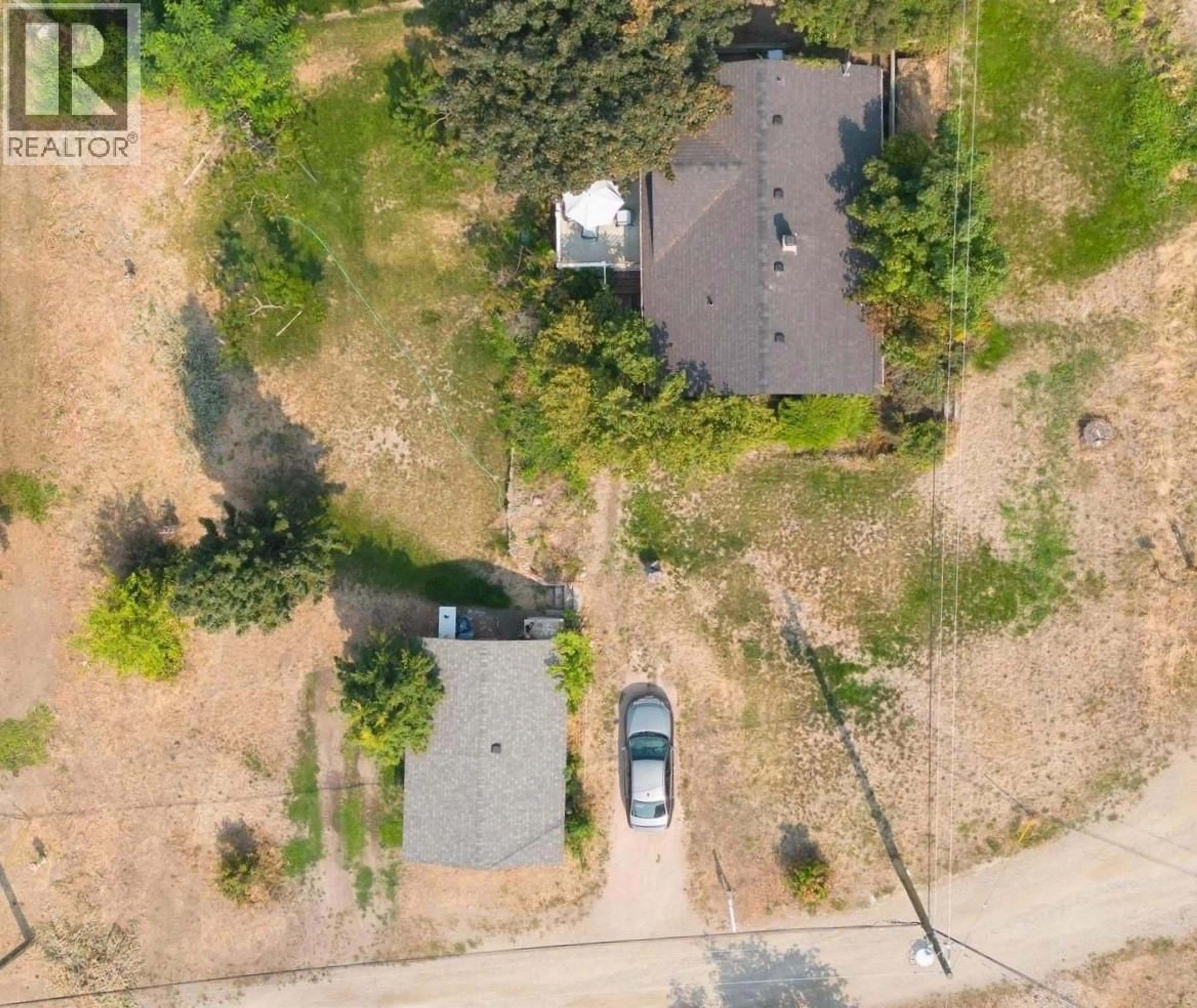 A pic from outside/outdoor area/front of a property/back of a property/a pic from drone, street for 1210 EIGHTH STREET, Lake Country British Columbia V4V2J5