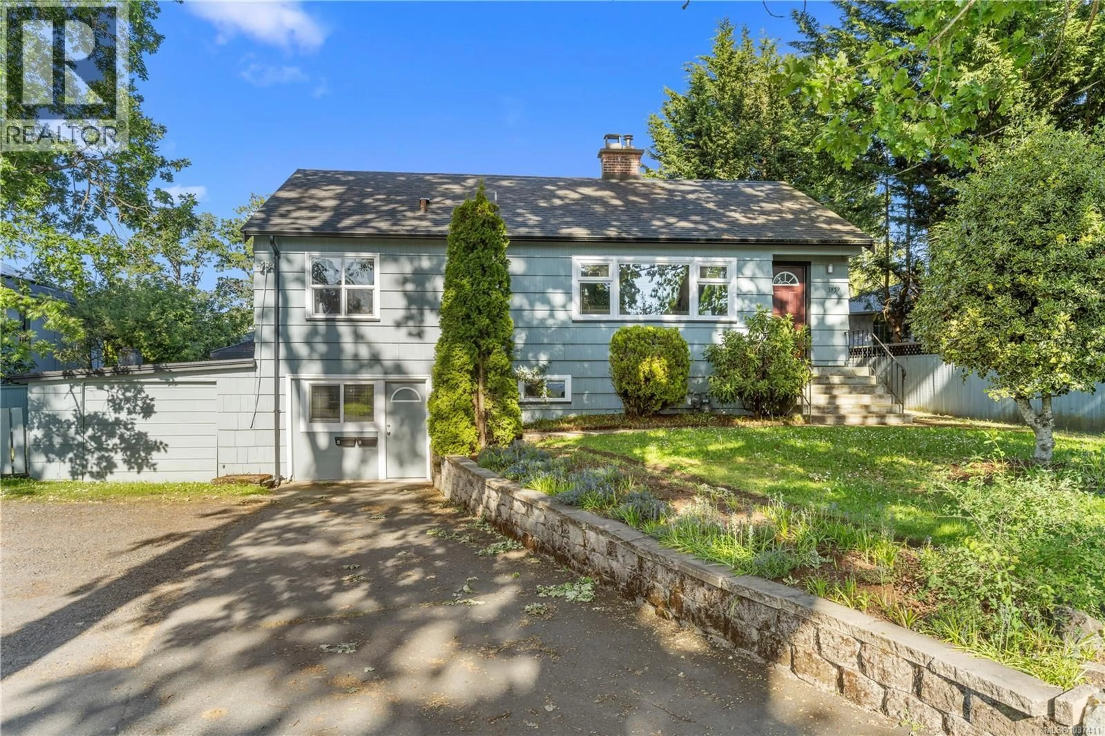 Home with vinyl exterior material, street for 3959 CEDAR HILL CROSS ROAD, Saanich British Columbia V8P2N8