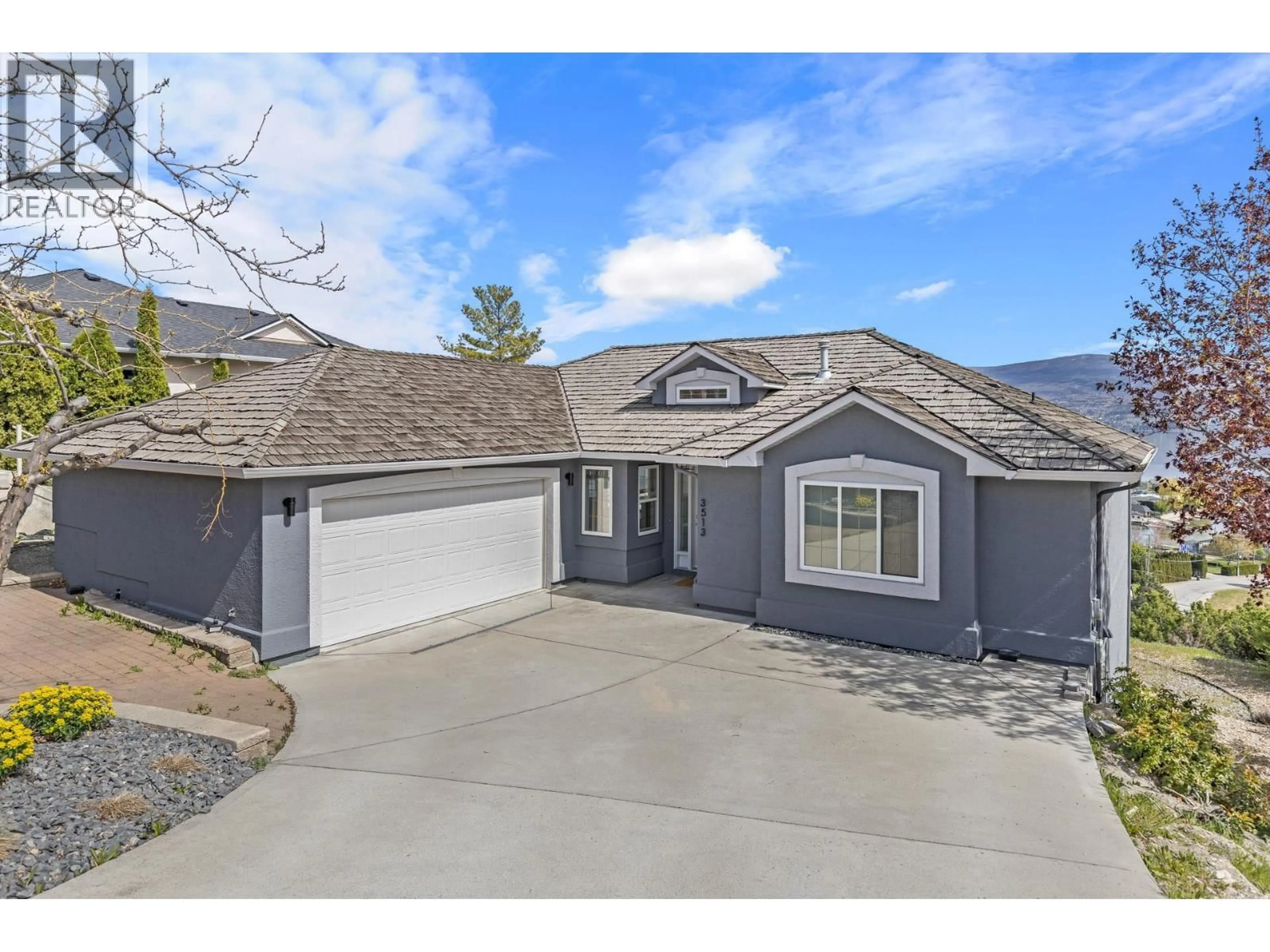 Home with vinyl exterior material, street for 3513 EMPIRE PLACE, West Kelowna British Columbia V4T1Y5