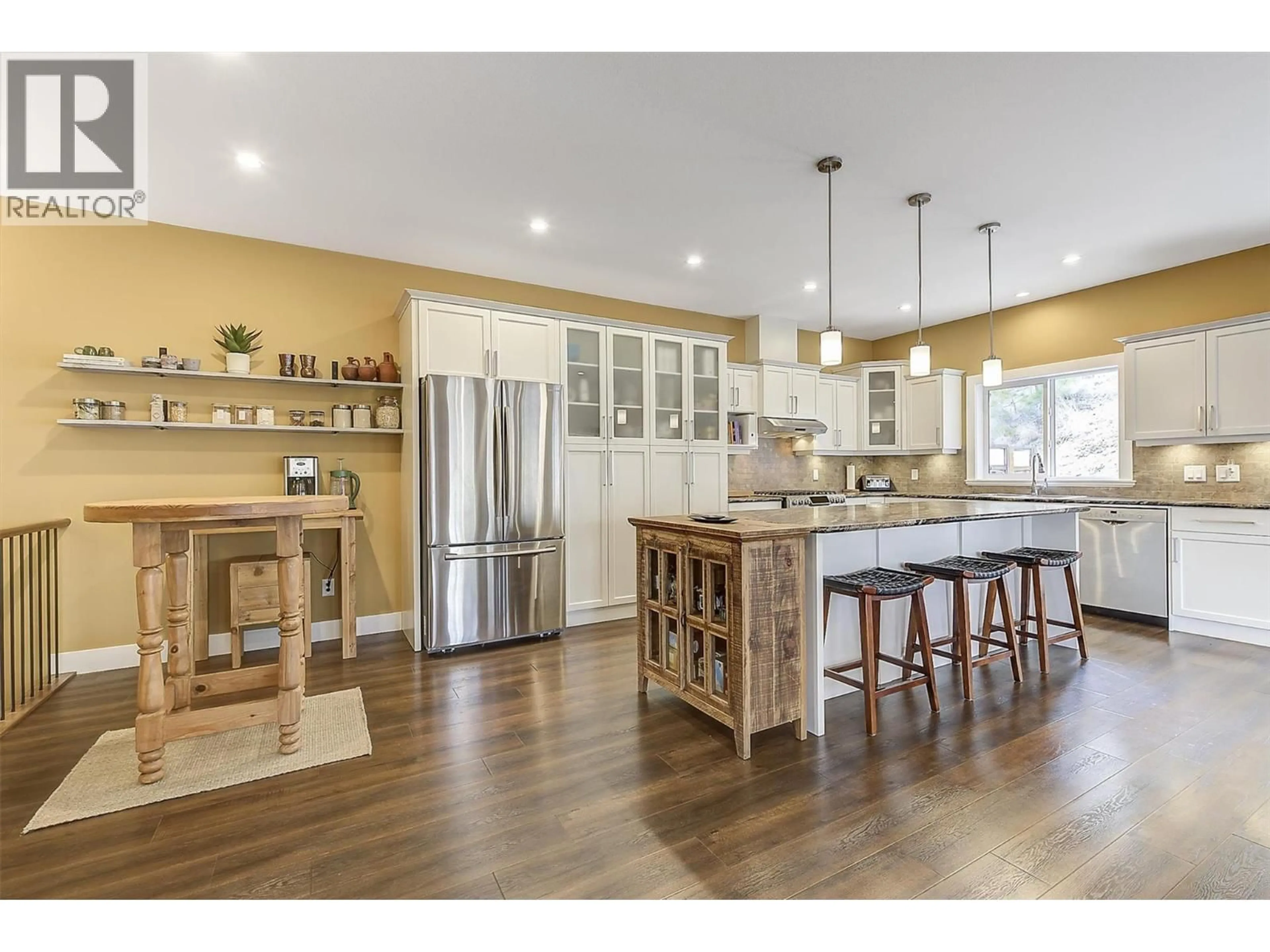 Open concept kitchen, wood/laminate floor for 8011 PIERRE DRIVE, Summerland British Columbia V0H1Z2