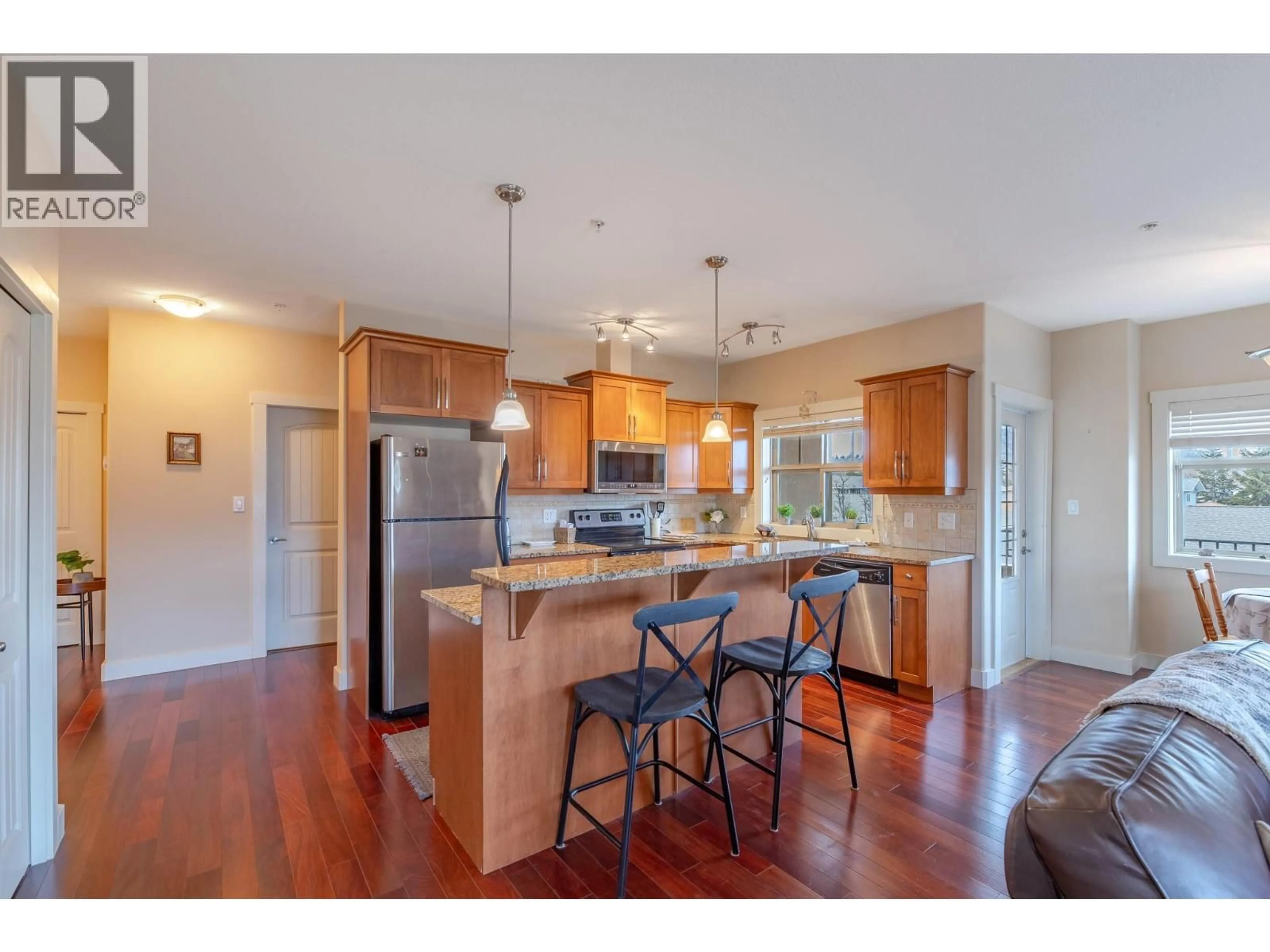 Open concept kitchen, wood/laminate floor for 210 - 13615 VICTORIA ROAD, Summerland British Columbia V0H1Z5