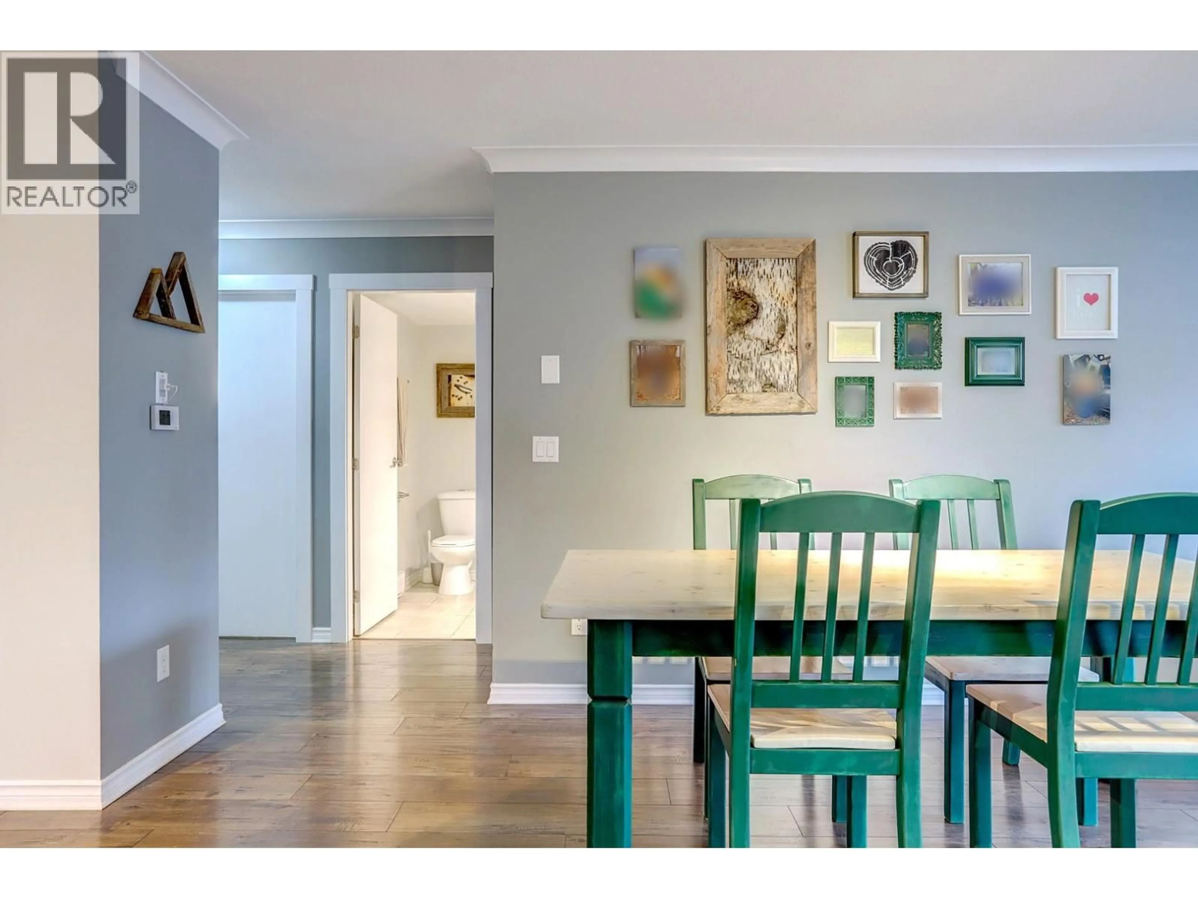 Dining room, wood/laminate floor for 104 - 669 HOUGHTON ROAD, Kelowna British Columbia V1X7L3