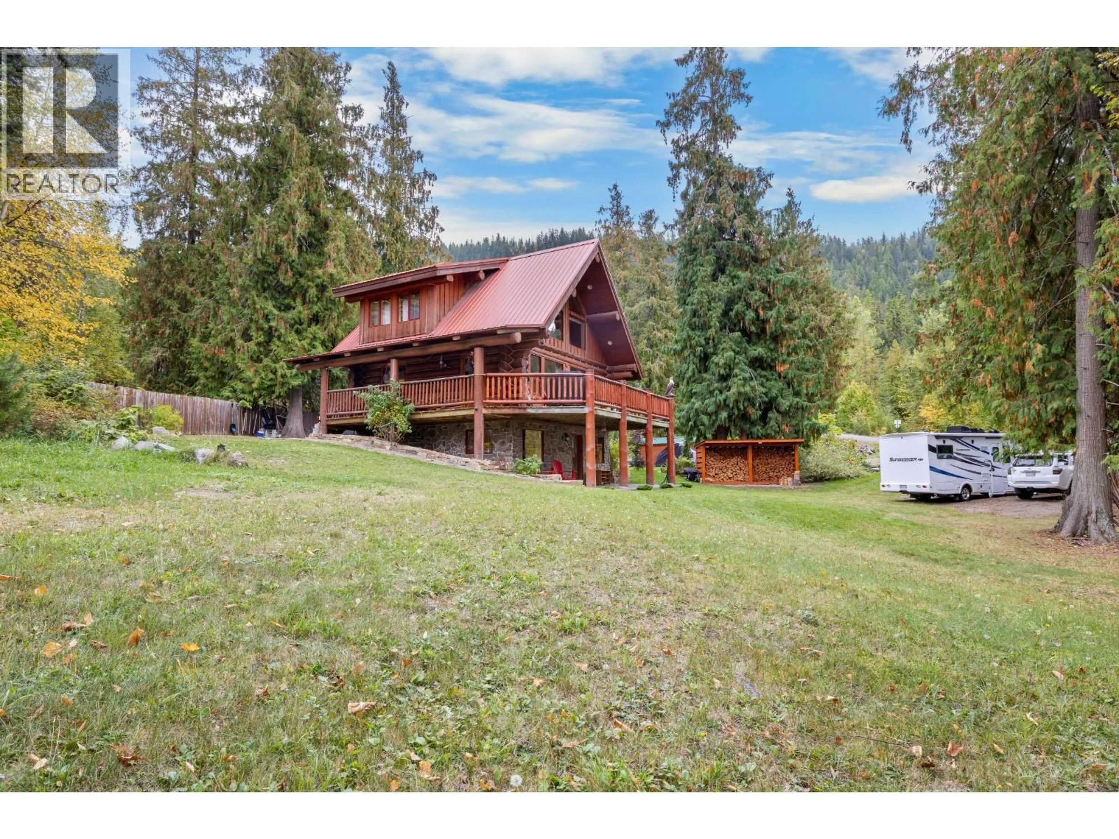 A pic from outside/outdoor area/front of a property/back of a property/a pic from drone, mountain view for 14296 MAIA LANE, Gray Creek British Columbia V0B1S0
