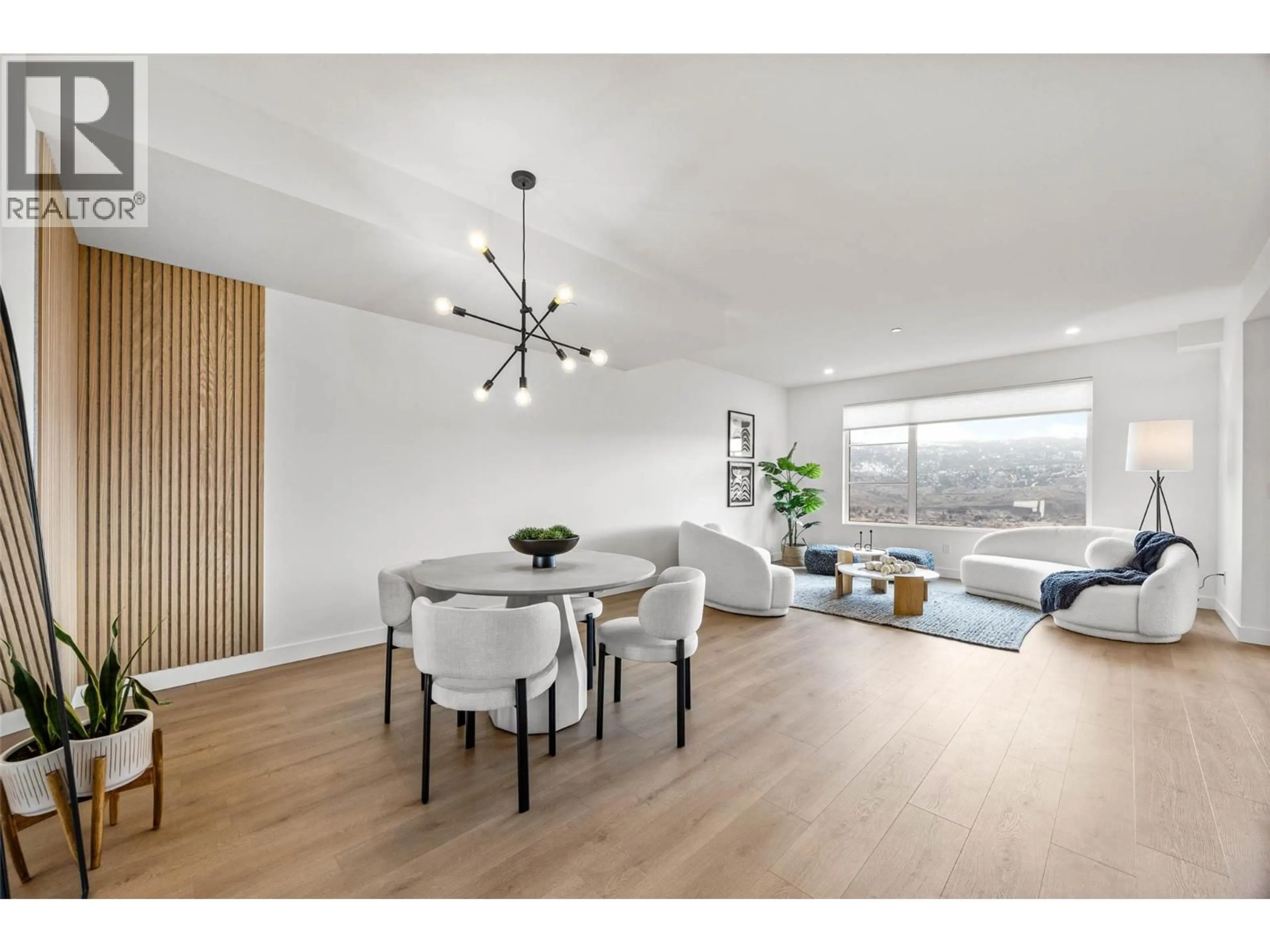 Living room with furniture, wood/laminate floor for 5044 SUN RIVERS DRIVE, Kamloops British Columbia V2H0E7