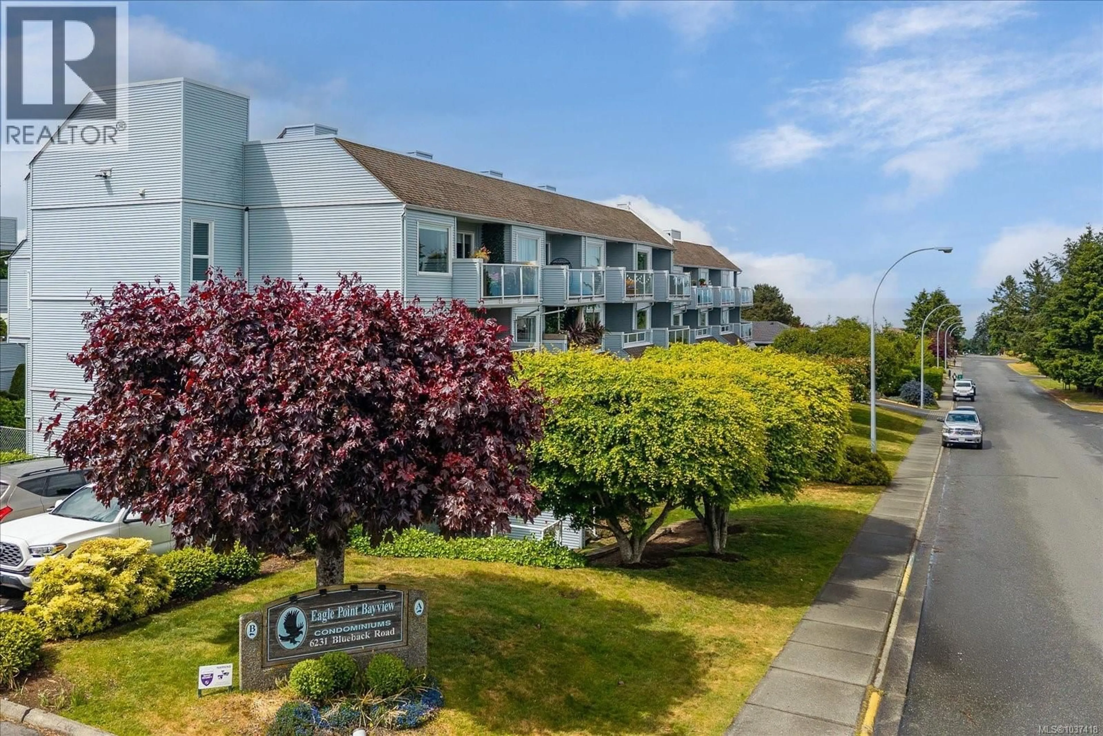 A pic from outside/outdoor area/front of a property/back of a property/a pic from drone, unknown for 215A - 6231 BLUEBACK ROAD, Nanaimo British Columbia V9J1J3