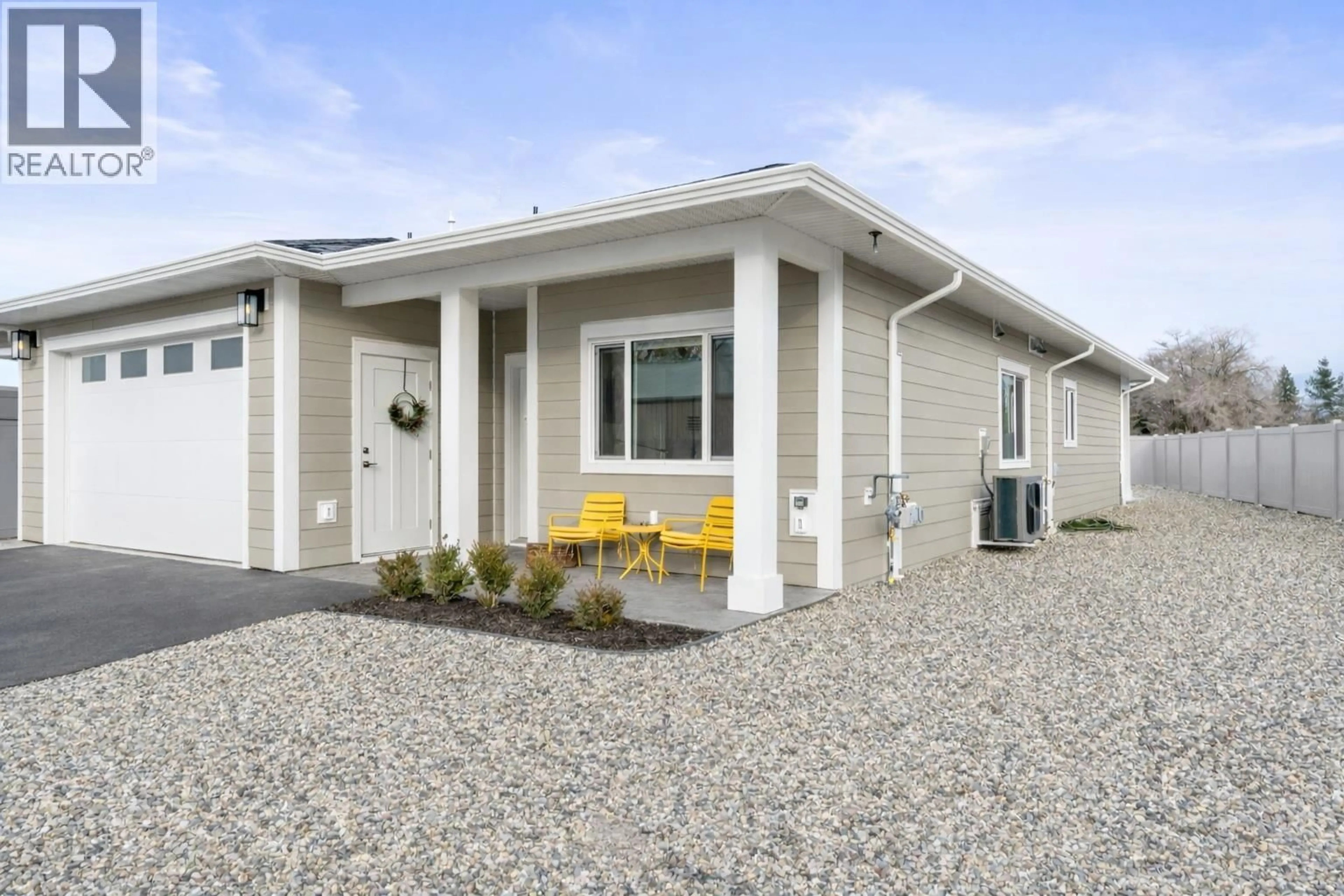 Home with vinyl exterior material, street for 6453 OKANAGAN LANDING ROAD, Vernon British Columbia V1H1M5
