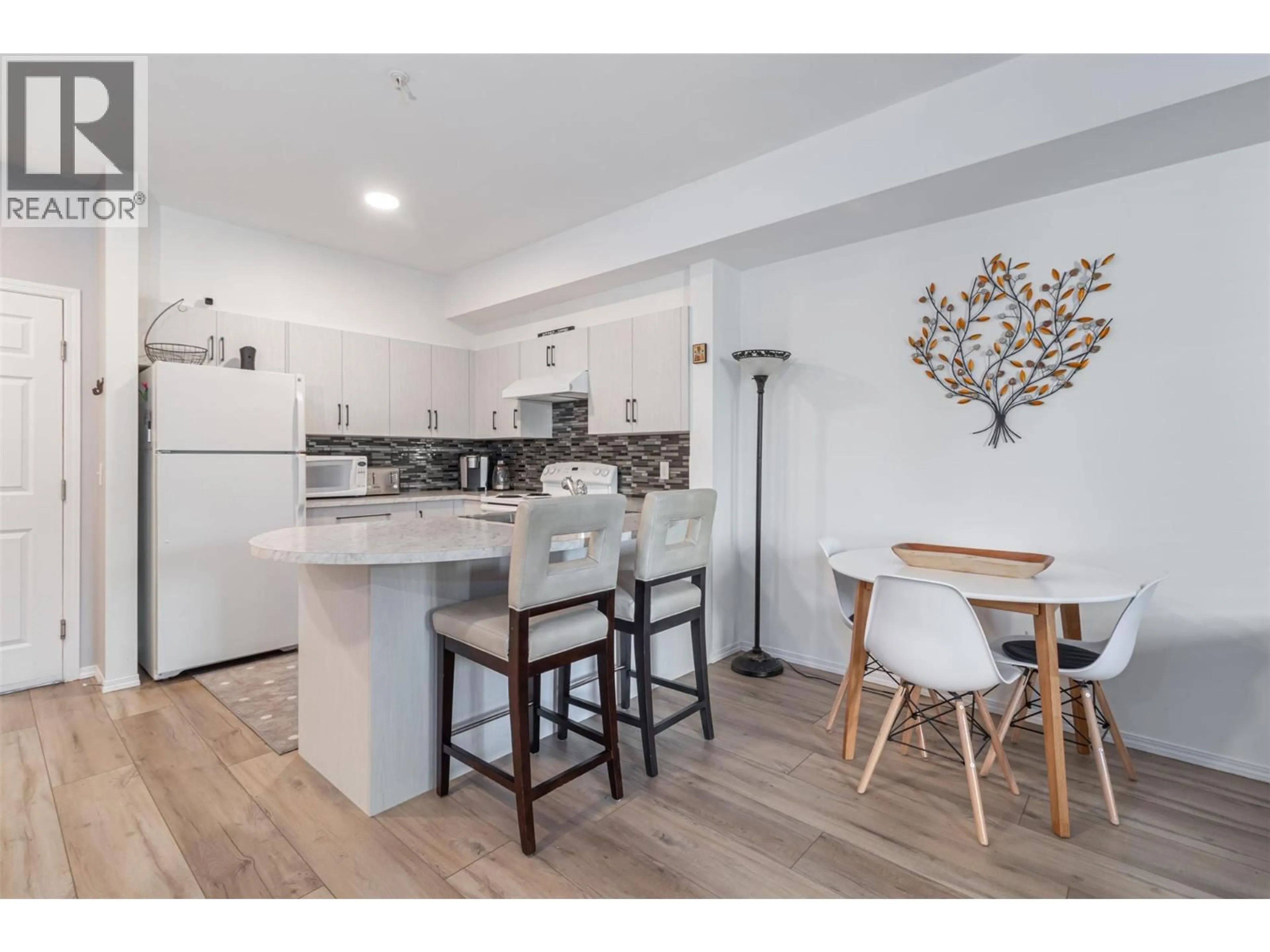 Open concept kitchen, wood/laminate floor for 2207 - 1873 COUNTRY CLUB DRIVE, Kelowna British Columbia V1V2A7