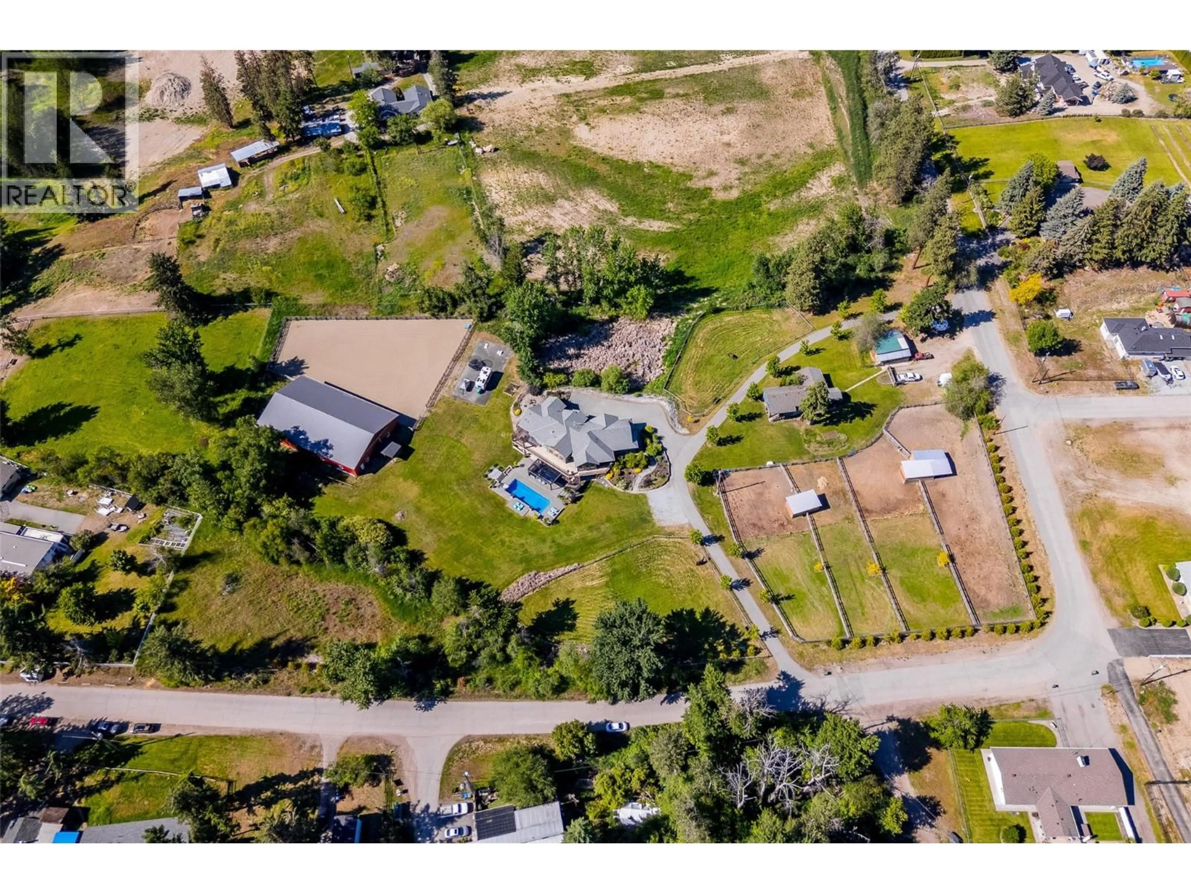 A pic from outside/outdoor area/front of a property/back of a property/a pic from drone, street for 4284 JAUD ROAD, Kelowna British Columbia V1W4C5