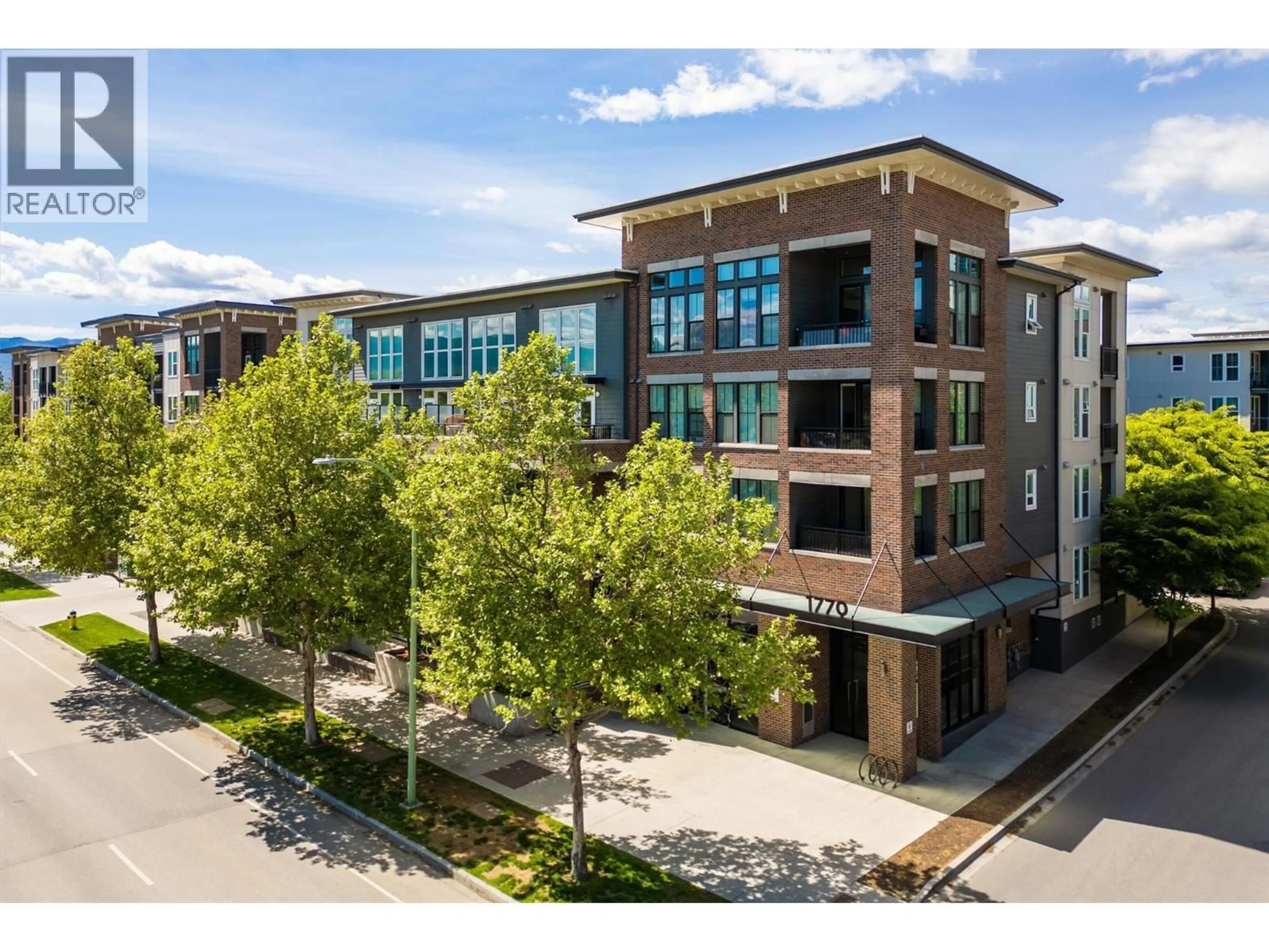 A pic from outside/outdoor area/front of a property/back of a property/a pic from drone, building for 105 - 1770 RICHTER STREET, Kelowna British Columbia V1Y0E6