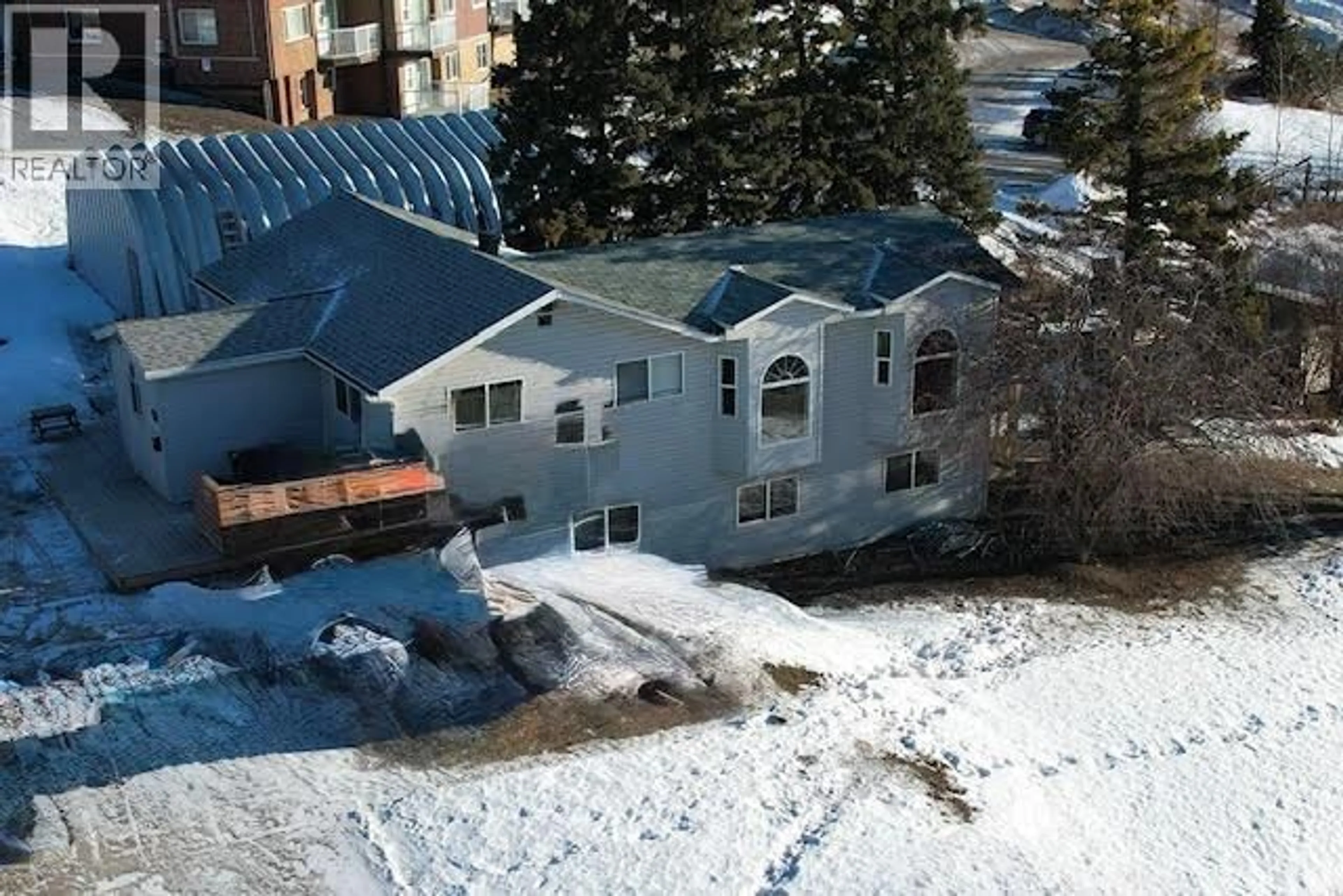 A pic from outside/outdoor area/front of a property/back of a property/a pic from drone, unknown for 705 100A AVENUE, Dawson Creek British Columbia V1G1X8
