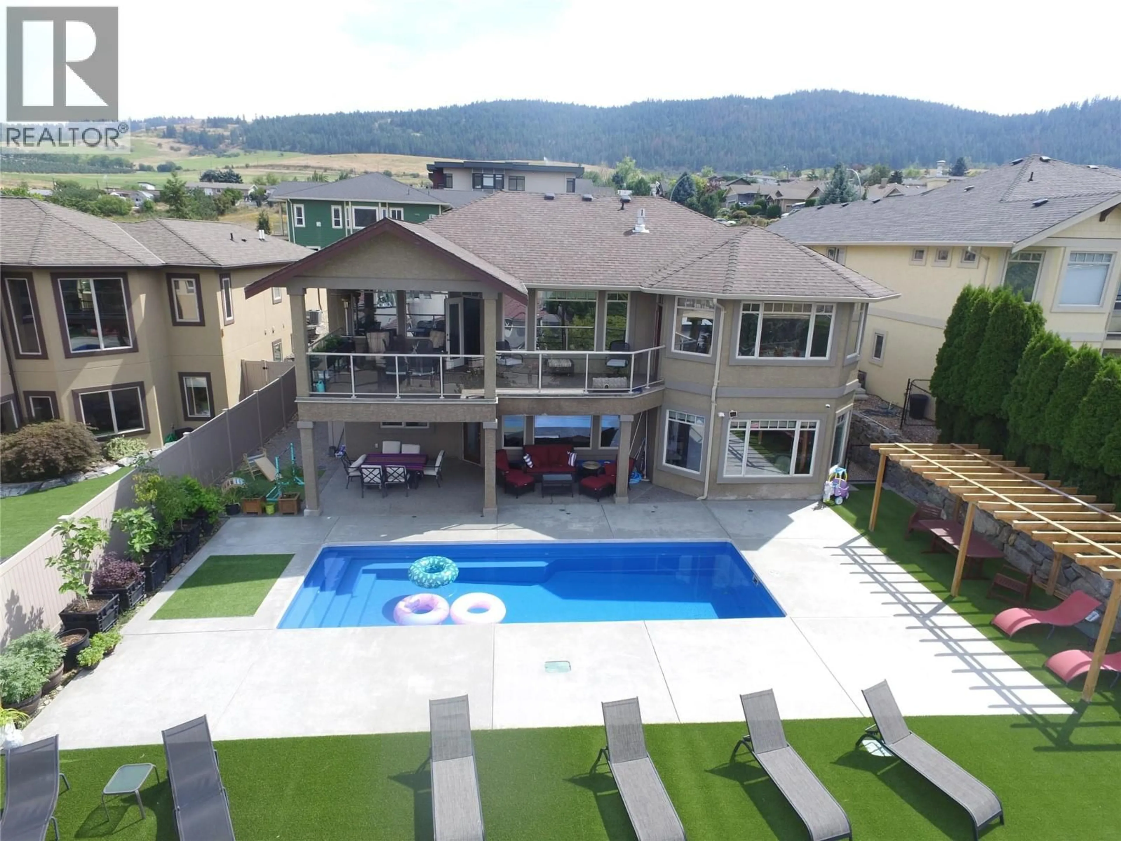 A pic from outside/outdoor area/front of a property/back of a property/a pic from drone, mountain view for 1033 LONGACRE PLACE, Vernon British Columbia V1H1H7