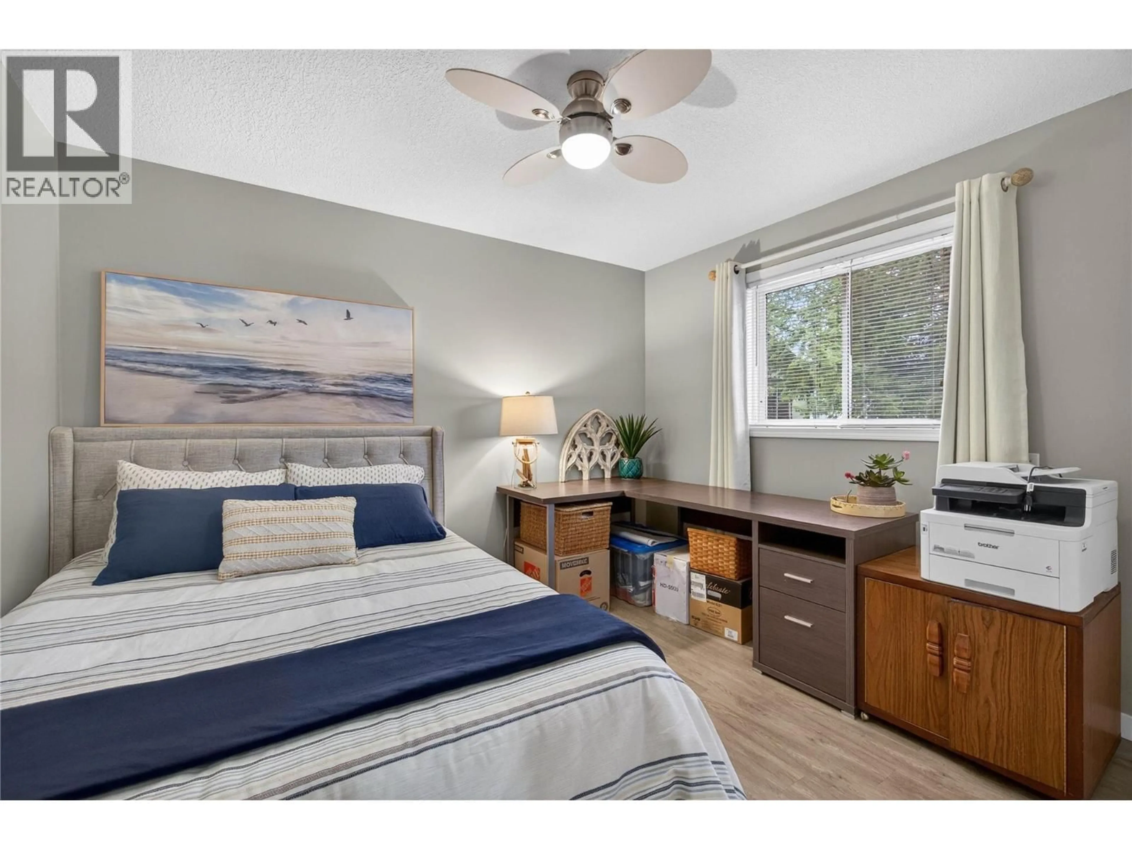 Bedroom with bed, wood/laminate floor for 206 FALCON AVENUE, Vernon British Columbia V1H2A1
