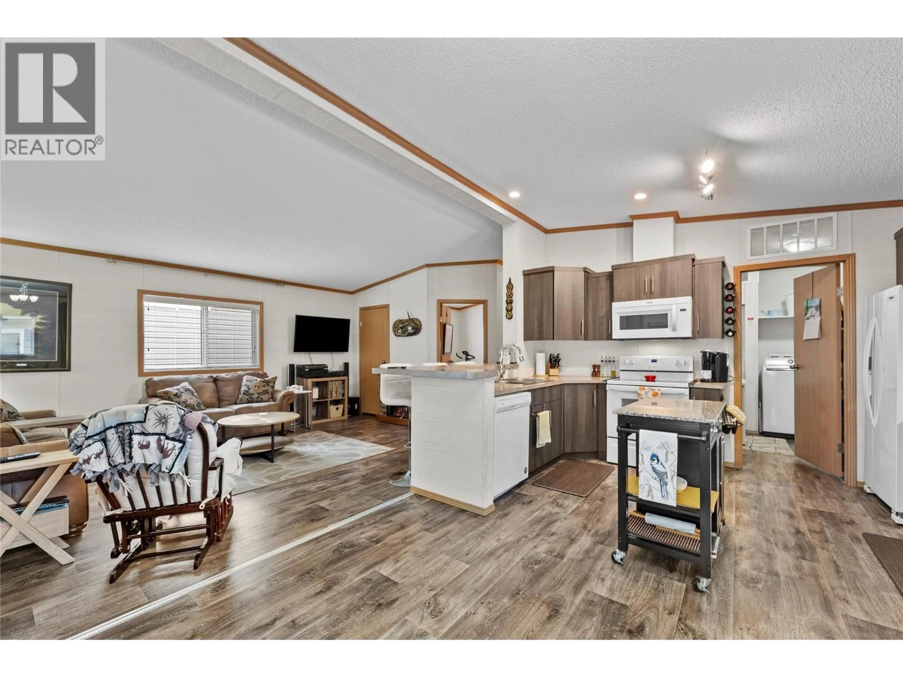 Open concept kitchen, wood/laminate floor for 52 - 7805 DALLAS DRIVE, Kamloops British Columbia V2C6X9