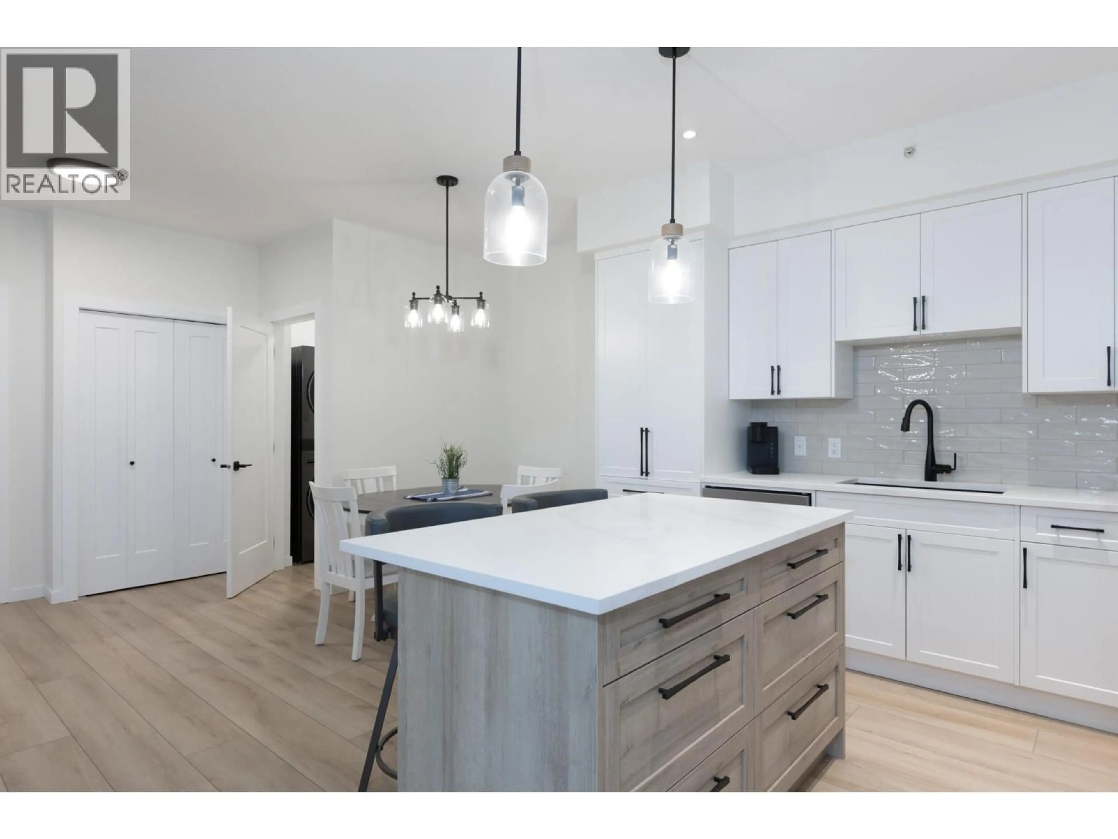 Open concept kitchen, wood/laminate floor for 400 - 680 LEQUIME ROAD, Kelowna British Columbia V1A1A4