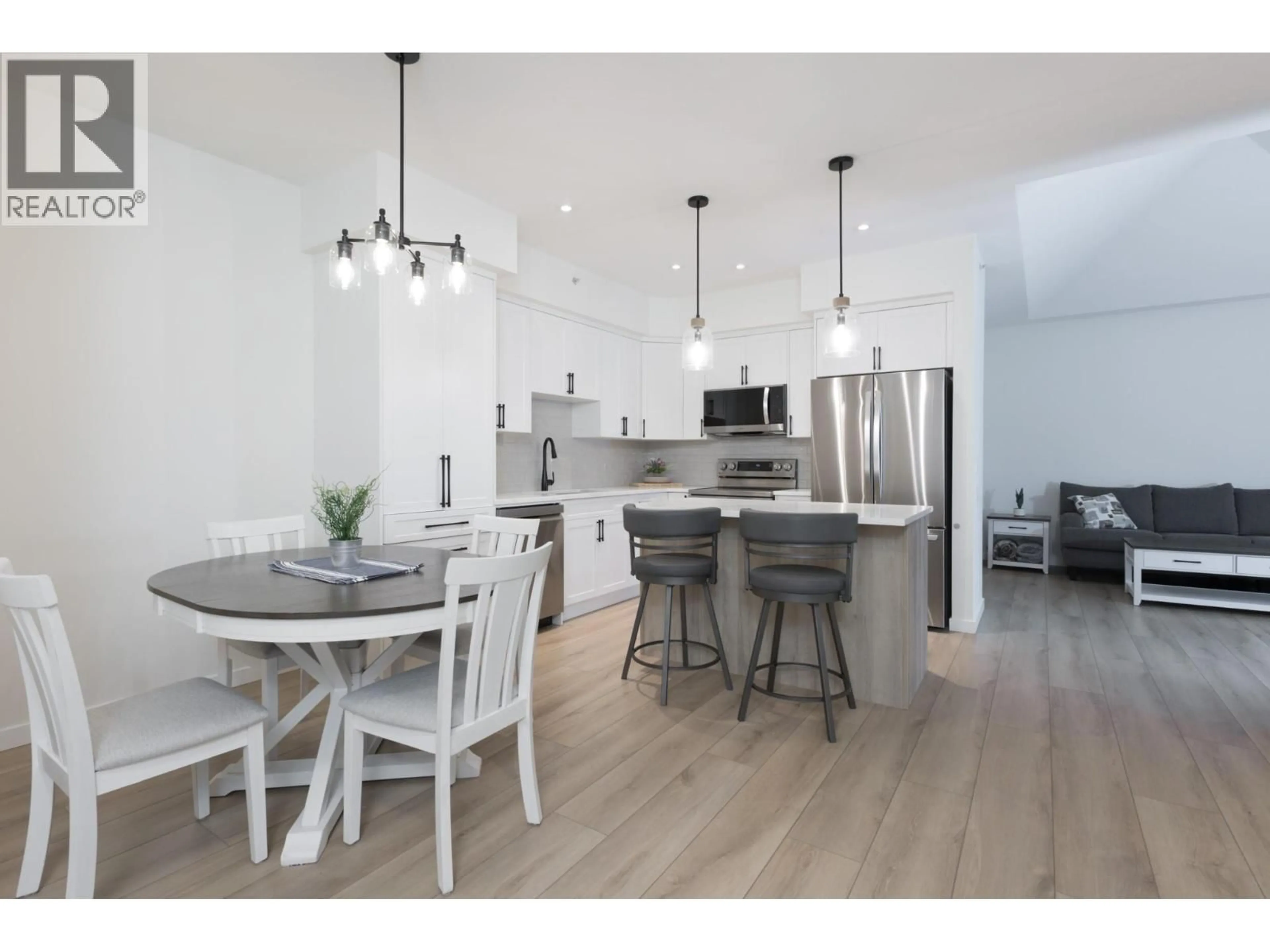 Open concept kitchen, wood/laminate floor for 400 - 680 LEQUIME ROAD, Kelowna British Columbia V1A1A4
