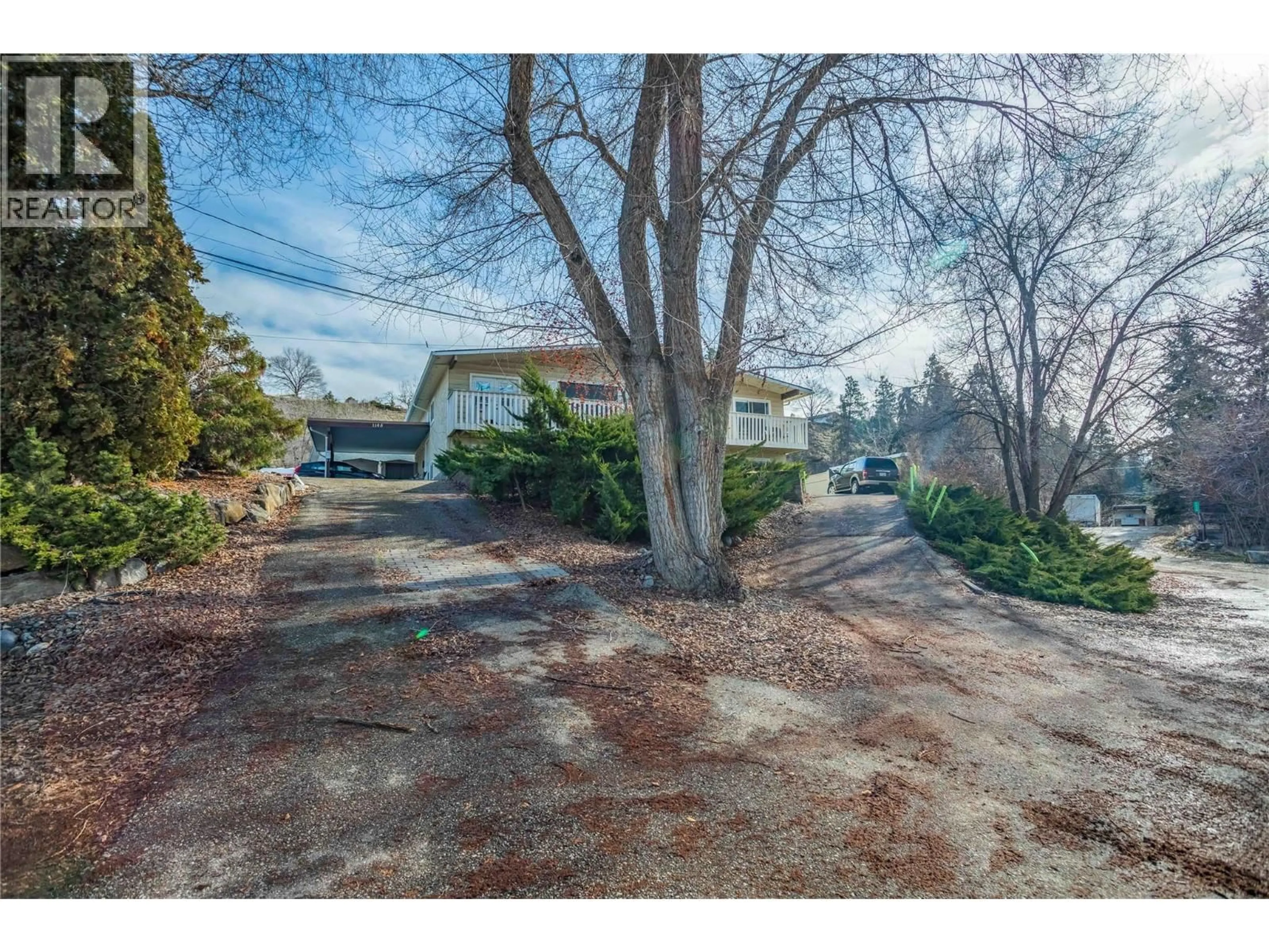 A pic from outside/outdoor area/front of a property/back of a property/a pic from drone, street for 1105 CACTUS ROAD, Kelowna British Columbia V1X5N3