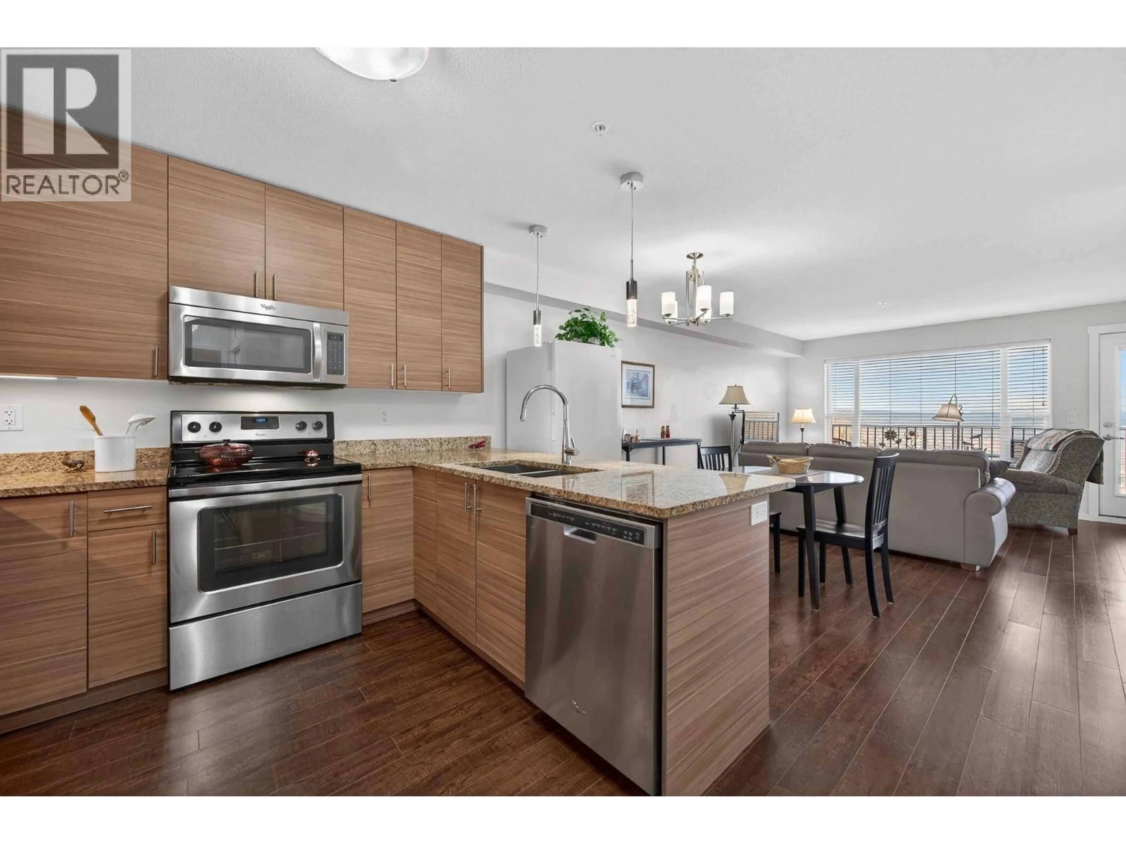 Open concept kitchen, wood/laminate floor for 306 - 1200 HARRISON PLACE, Kamloops British Columbia V1S1M1