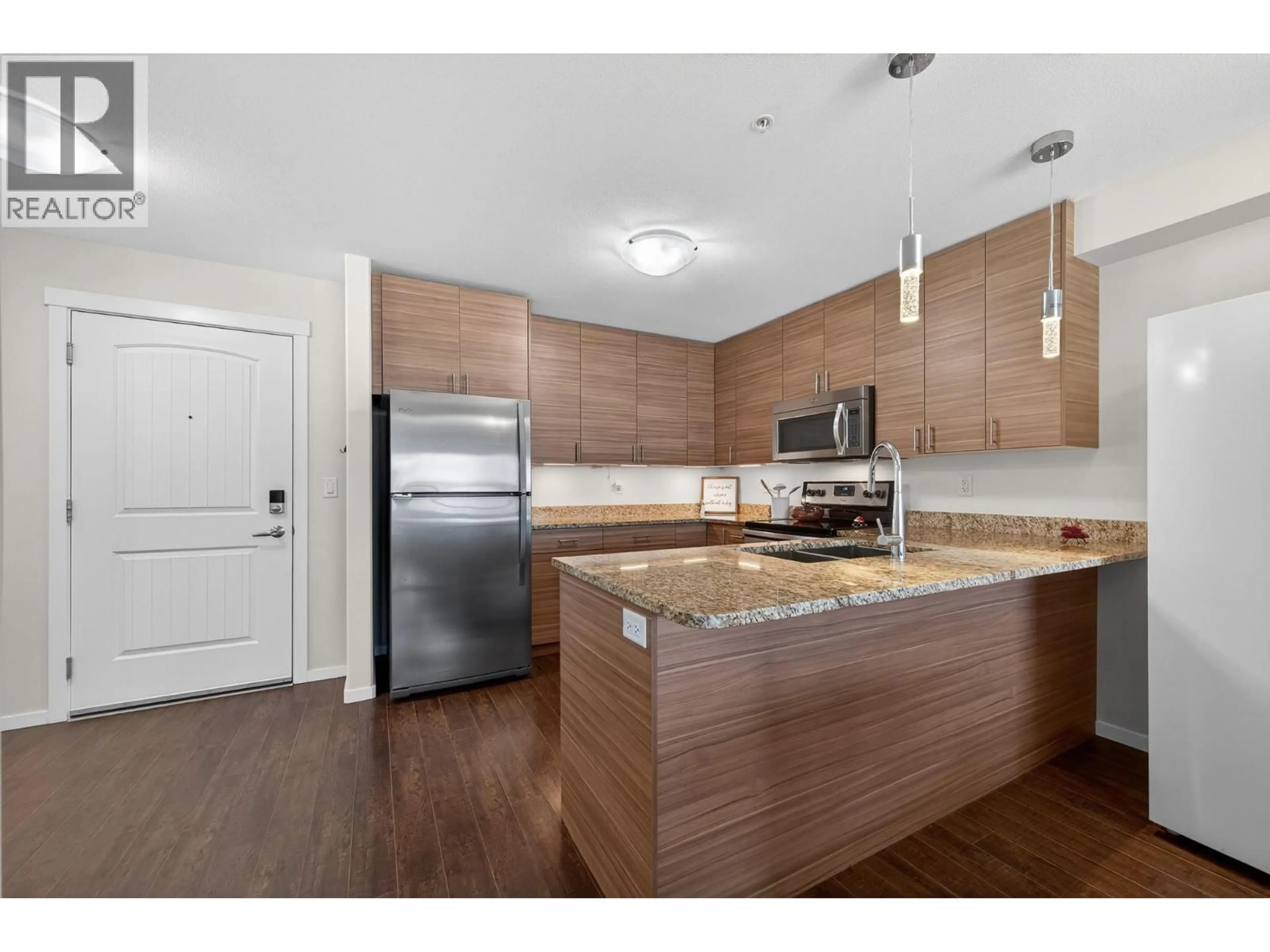 Open concept kitchen, wood/laminate floor for 306 - 1200 HARRISON PLACE, Kamloops British Columbia V1S1M1
