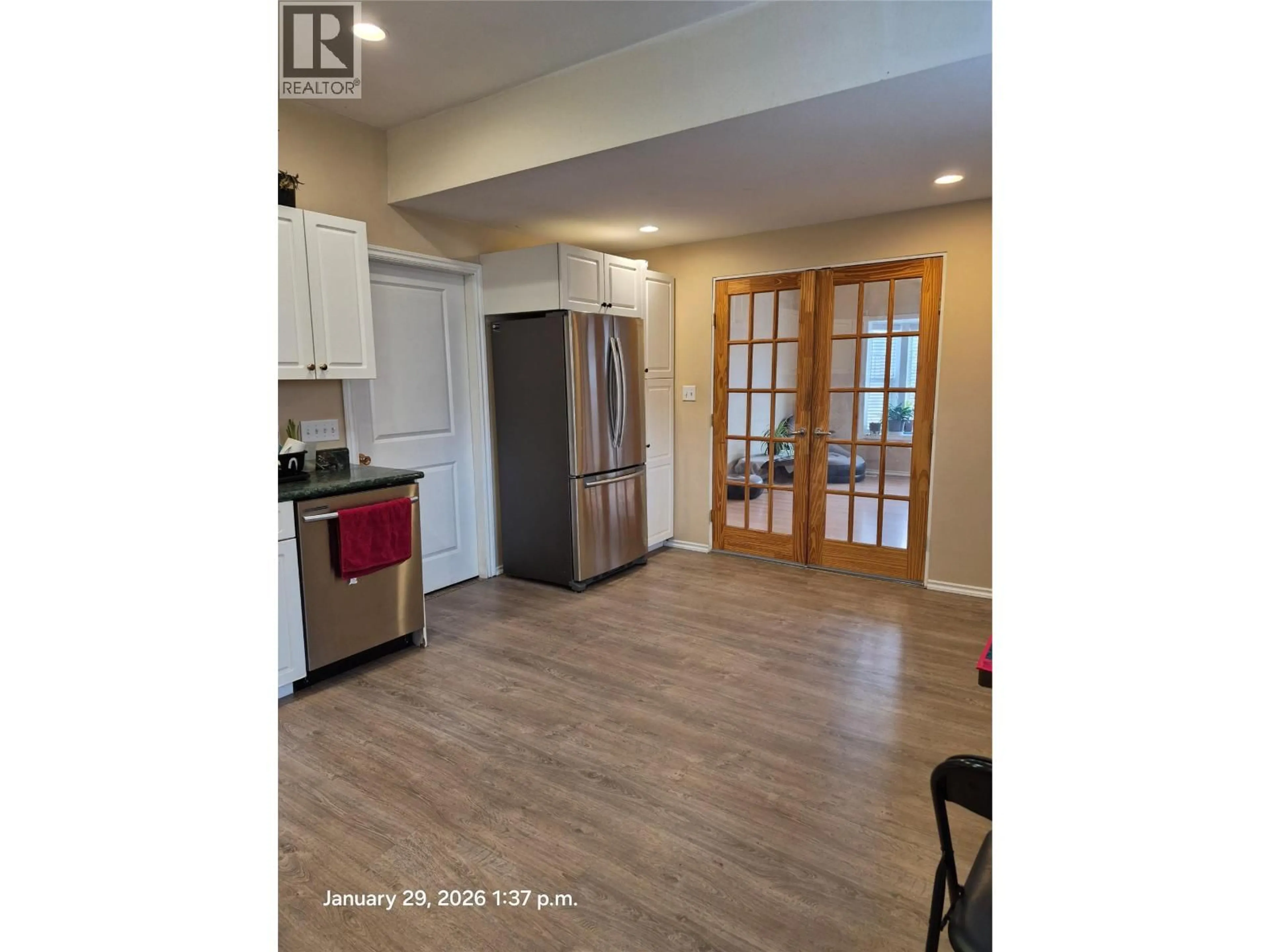 Open concept kitchen, wood/laminate floor for A + B - 1421 PINE STREET, Merritt British Columbia V1K1K5