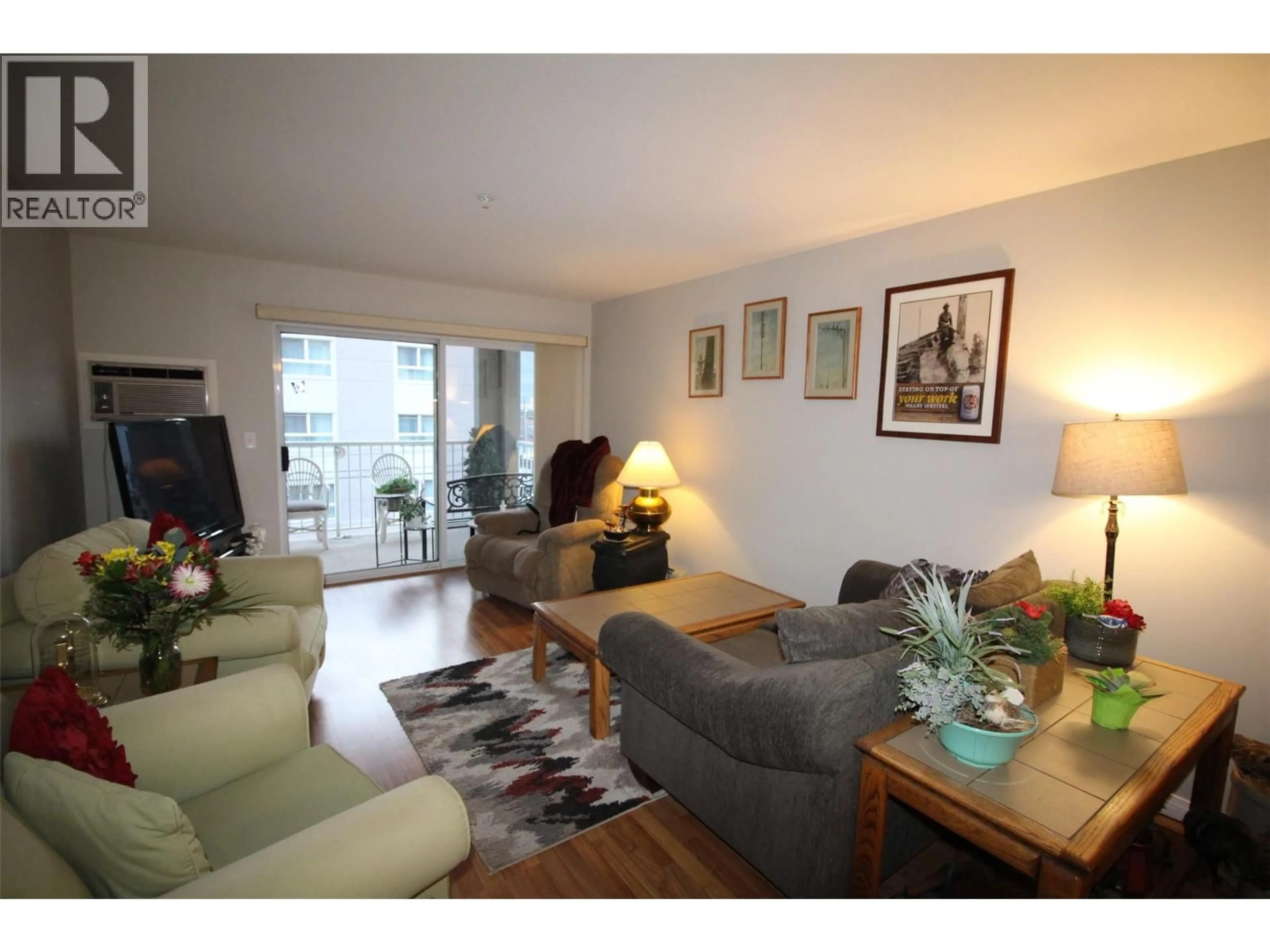 Living room with furniture, wood/laminate floor for 308 - 360 BATTLE STREET, Kamloops British Columbia V2C2L6