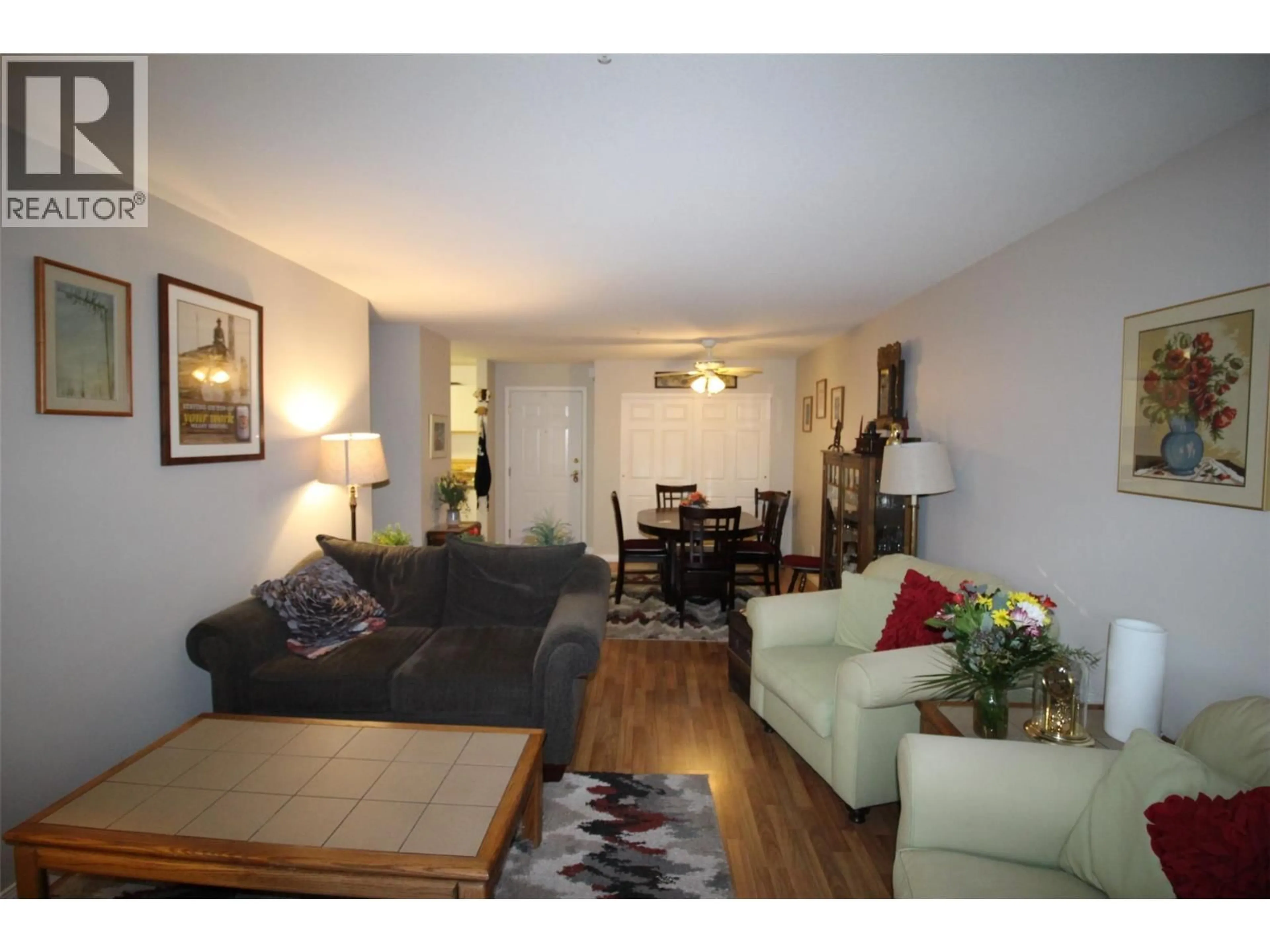 Living room with furniture, wood/laminate floor for 308 - 360 BATTLE STREET, Kamloops British Columbia V2C2L6