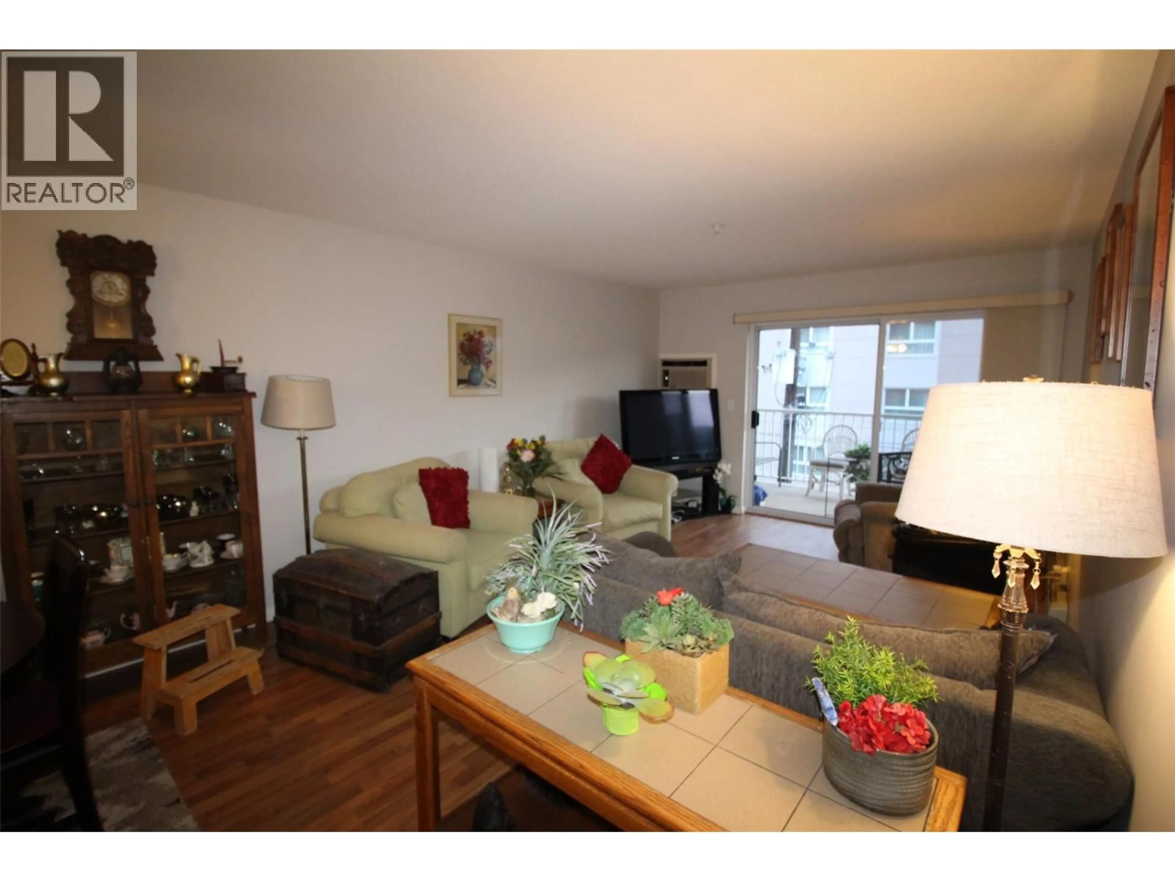 Living room with furniture, wood/laminate floor for 308 - 360 BATTLE STREET, Kamloops British Columbia V2C2L6