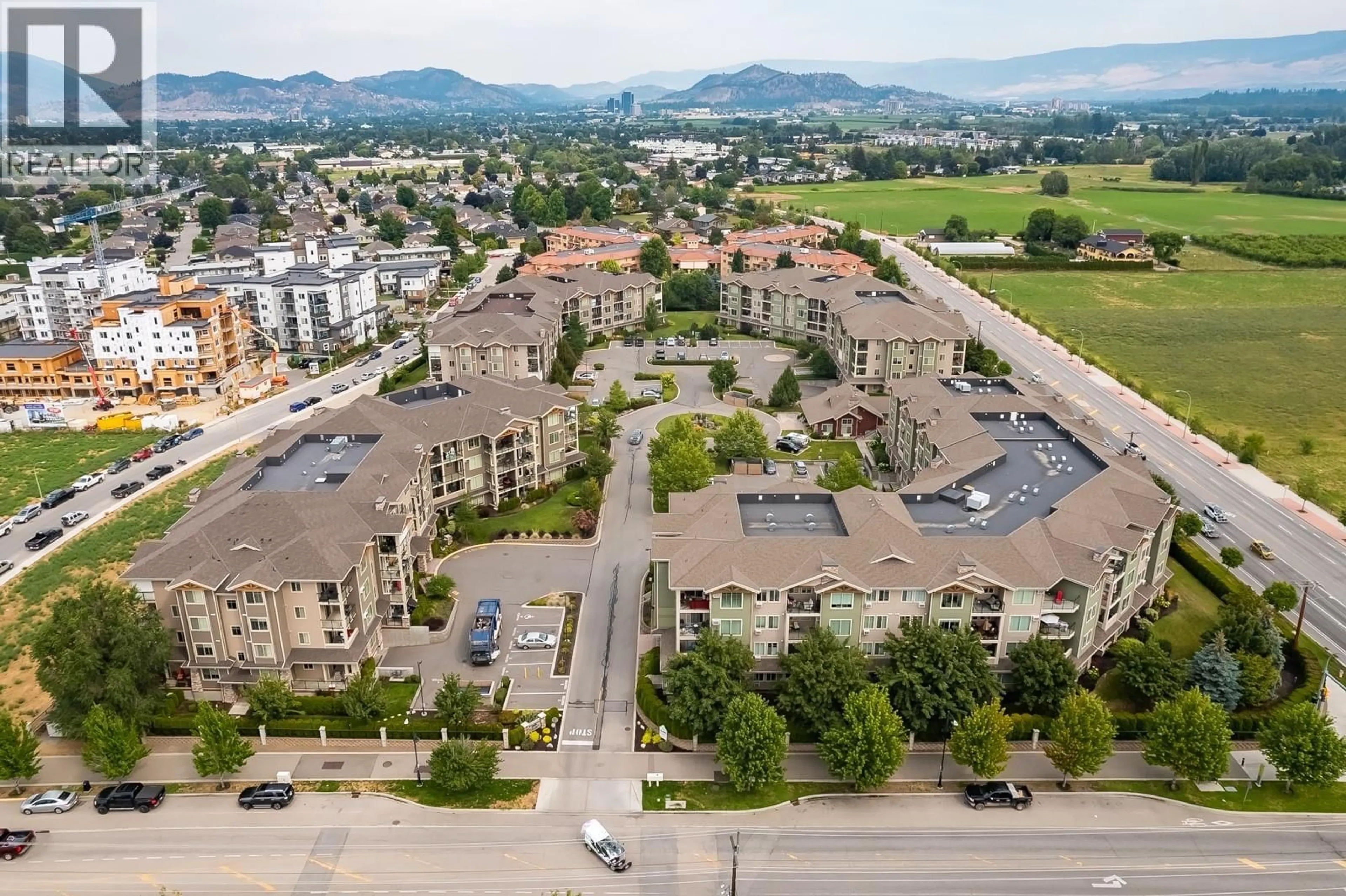 A pic from outside/outdoor area/front of a property/back of a property/a pic from drone, mountain view for 313 - 3739 CASORSO ROAD, Kelowna British Columbia V1W5E8