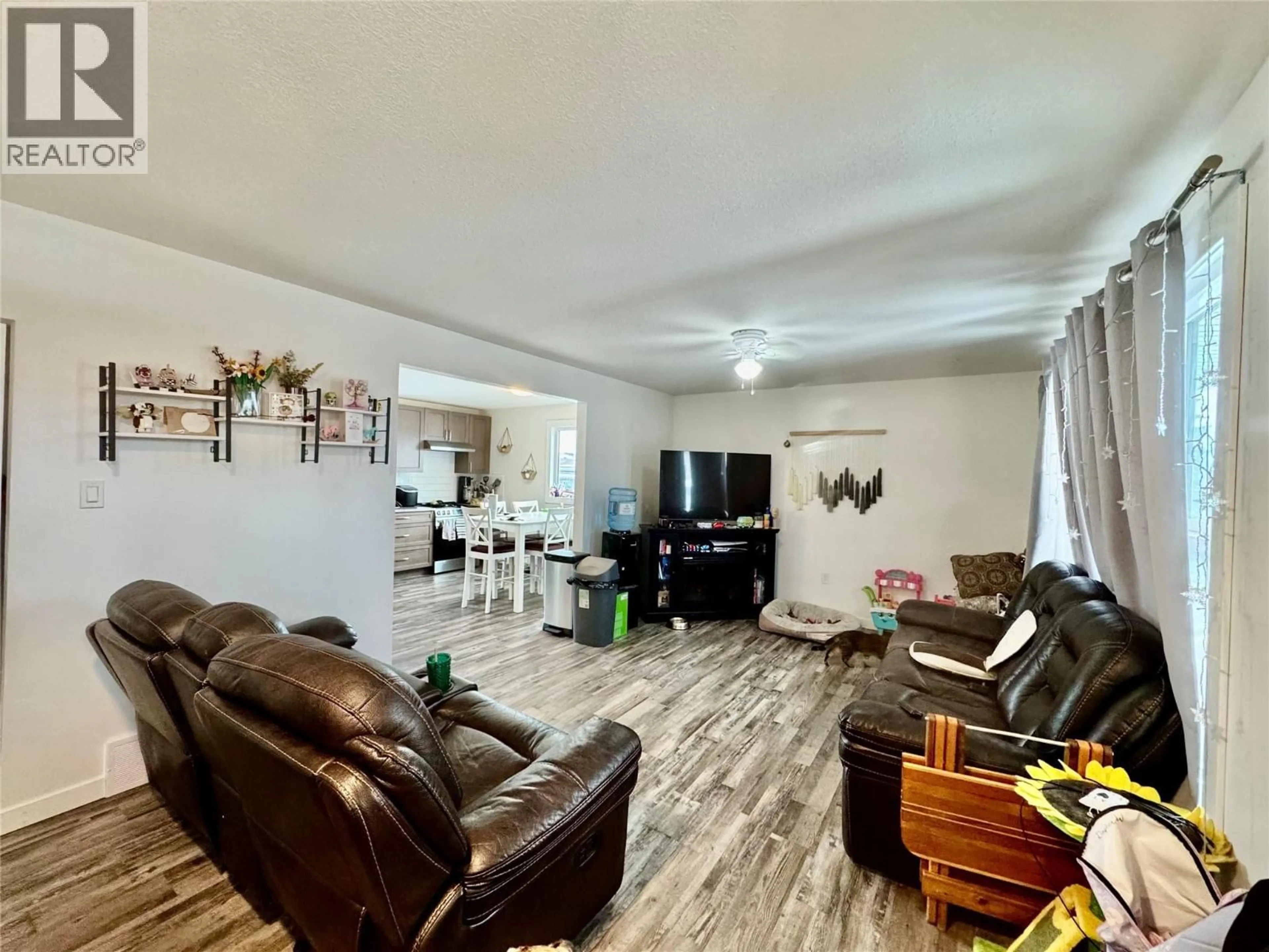 Living room with furniture, wood/laminate floor for 9120 8 STREET, Dawson Creek British Columbia V1G3N4