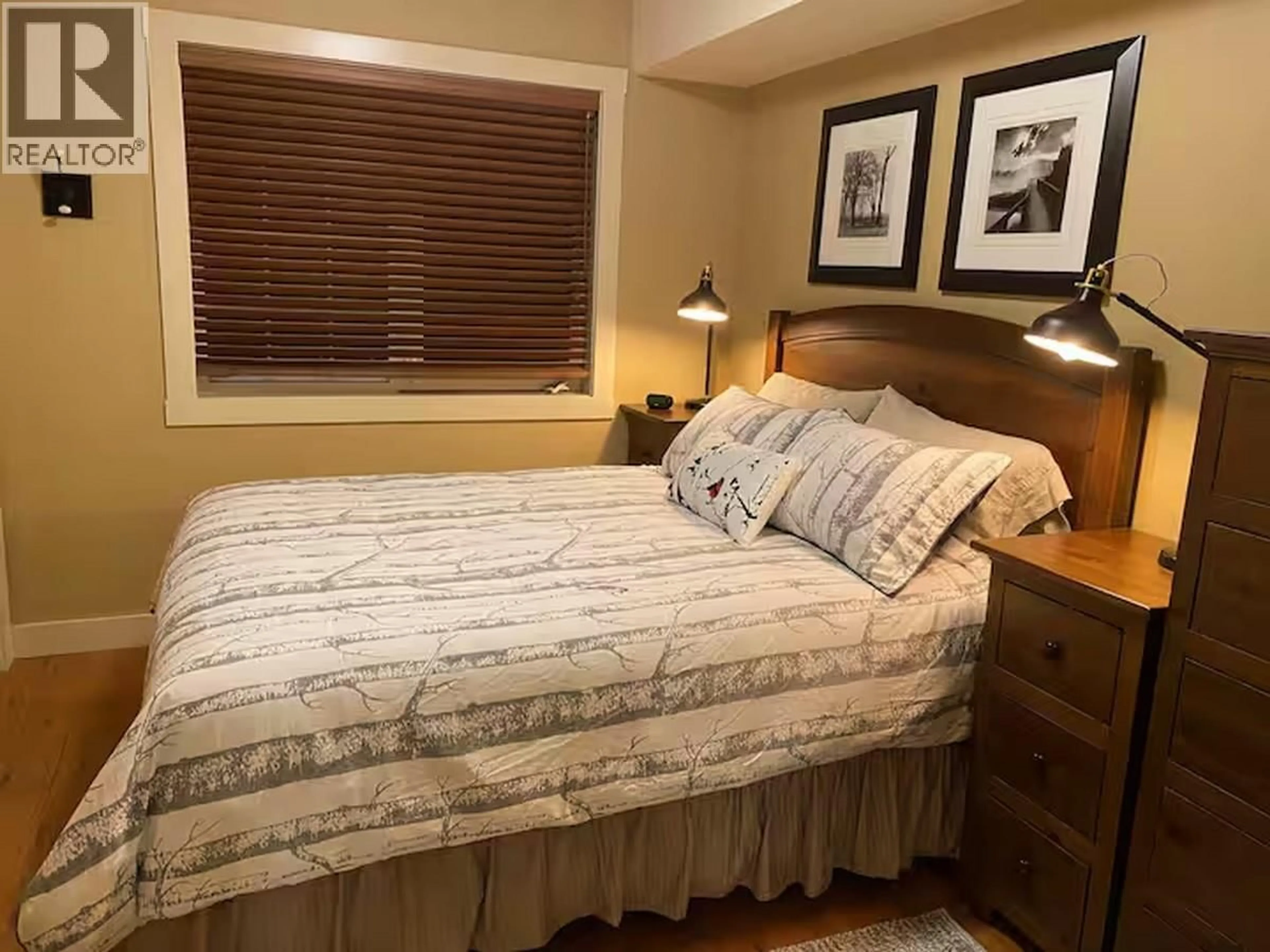 Bedroom with bed, wood/laminate floor for 13 - 1322 KAUFMANN VIEW, Golden British Columbia V0H1H2