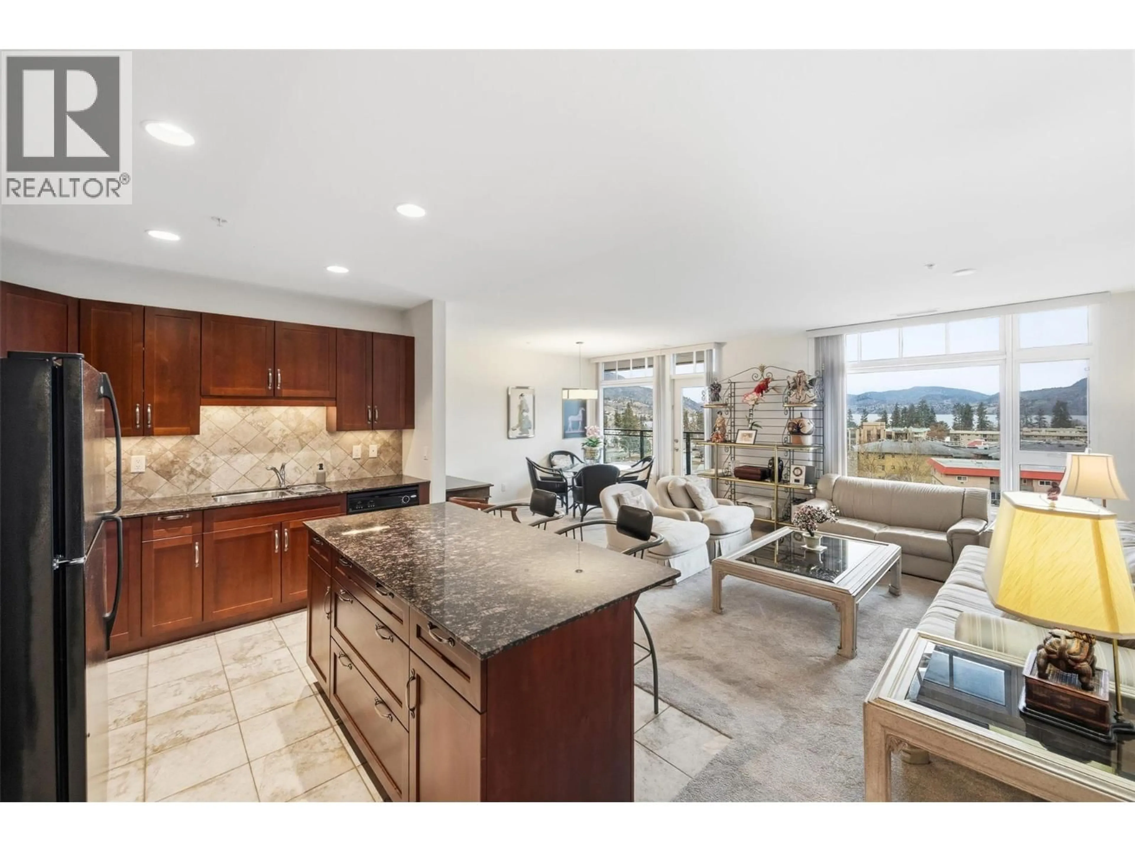 Open concept kitchen, ceramic/tile floor for 704 - 3301 SKAHA LAKE ROAD, Penticton British Columbia V2A6G6