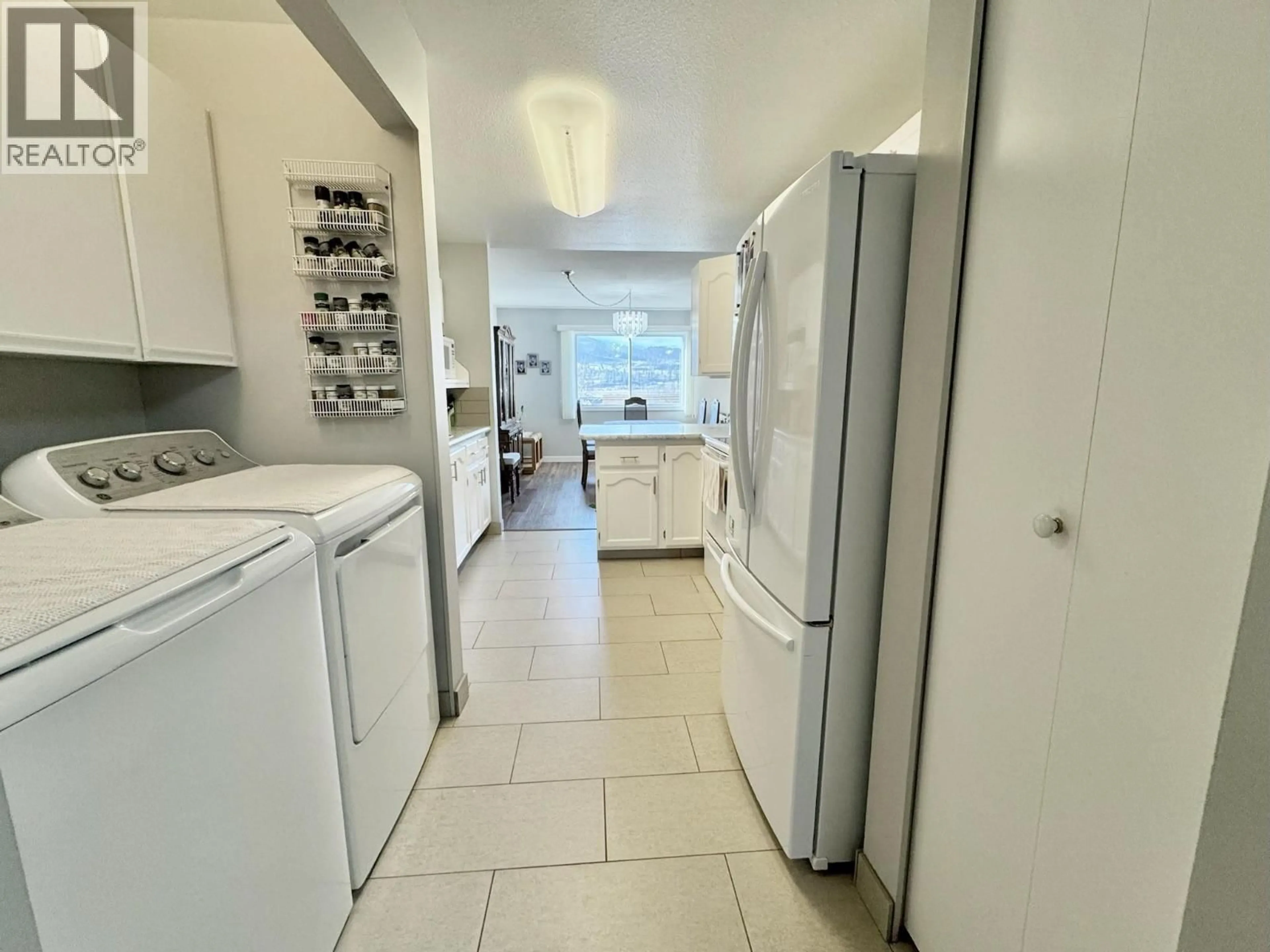 Kitchen with laundary machines, unknown for 308 - 195 WARREN AVE STREET WEST, Penticton British Columbia V2A3N1