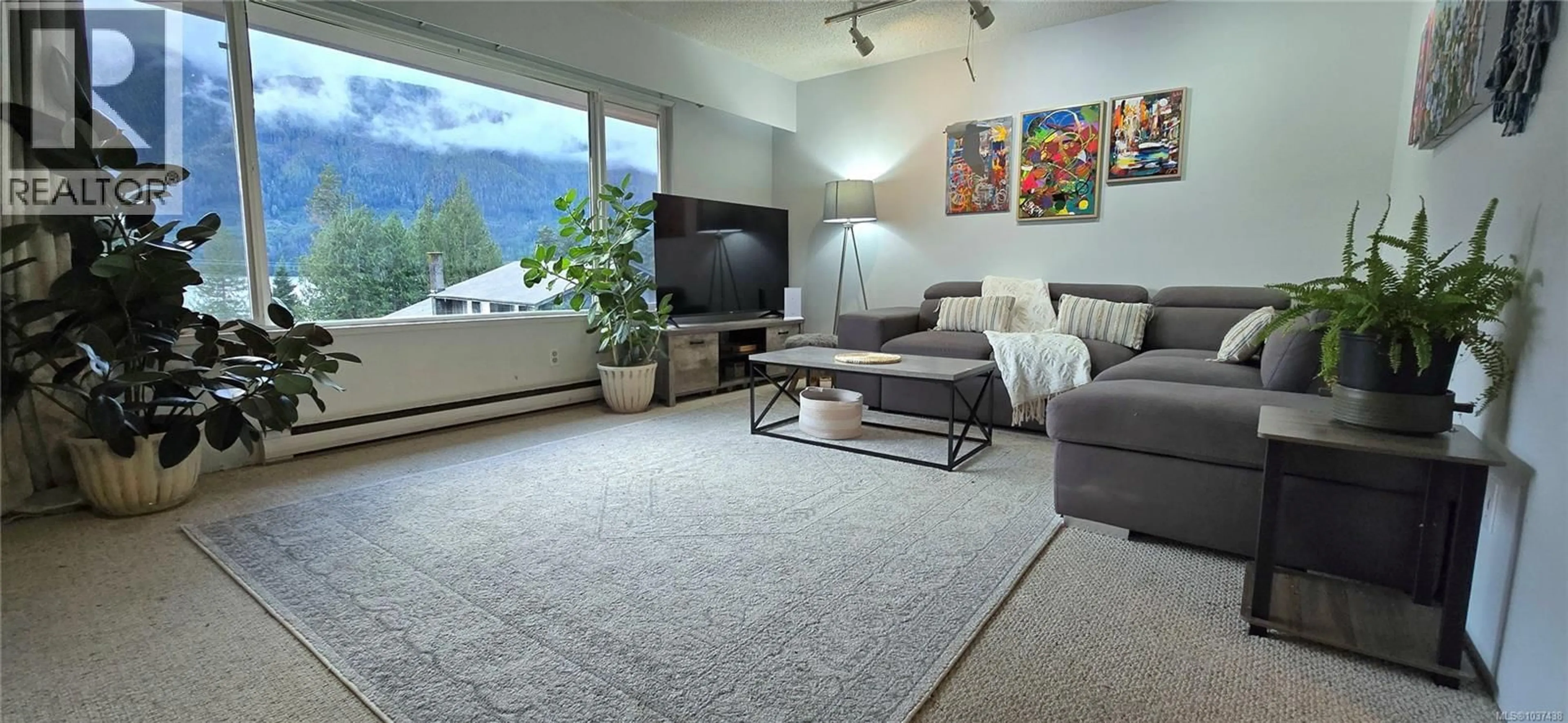 Living room with furniture, carpet floor for 1112 MAQUINNA AVENUE, Port Alice British Columbia V0N2N0