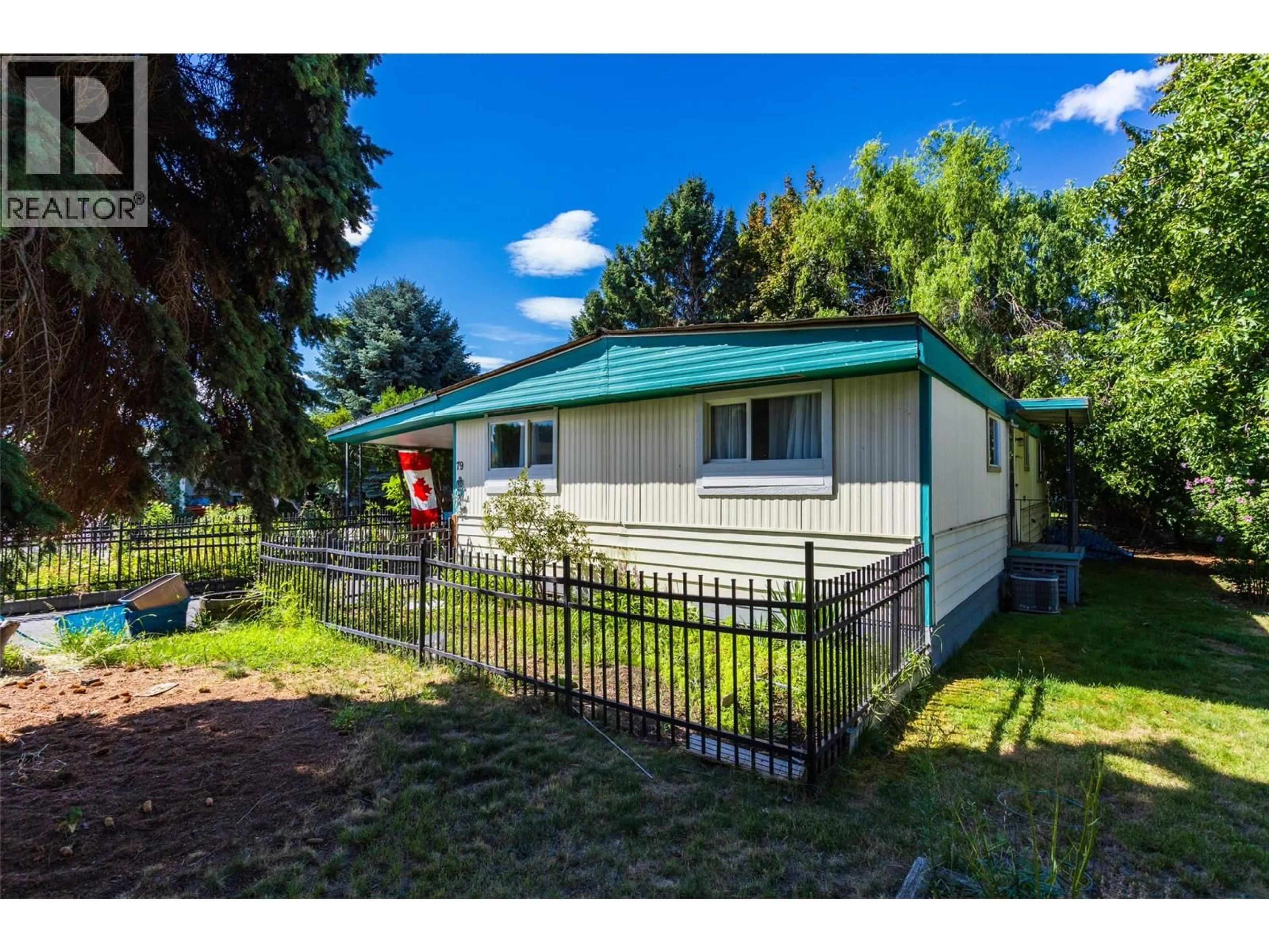 A pic from outside/outdoor area/front of a property/back of a property/a pic from drone, street for 79 - 3535 CASORSO ROAD, Kelowna British Columbia V1W3E1