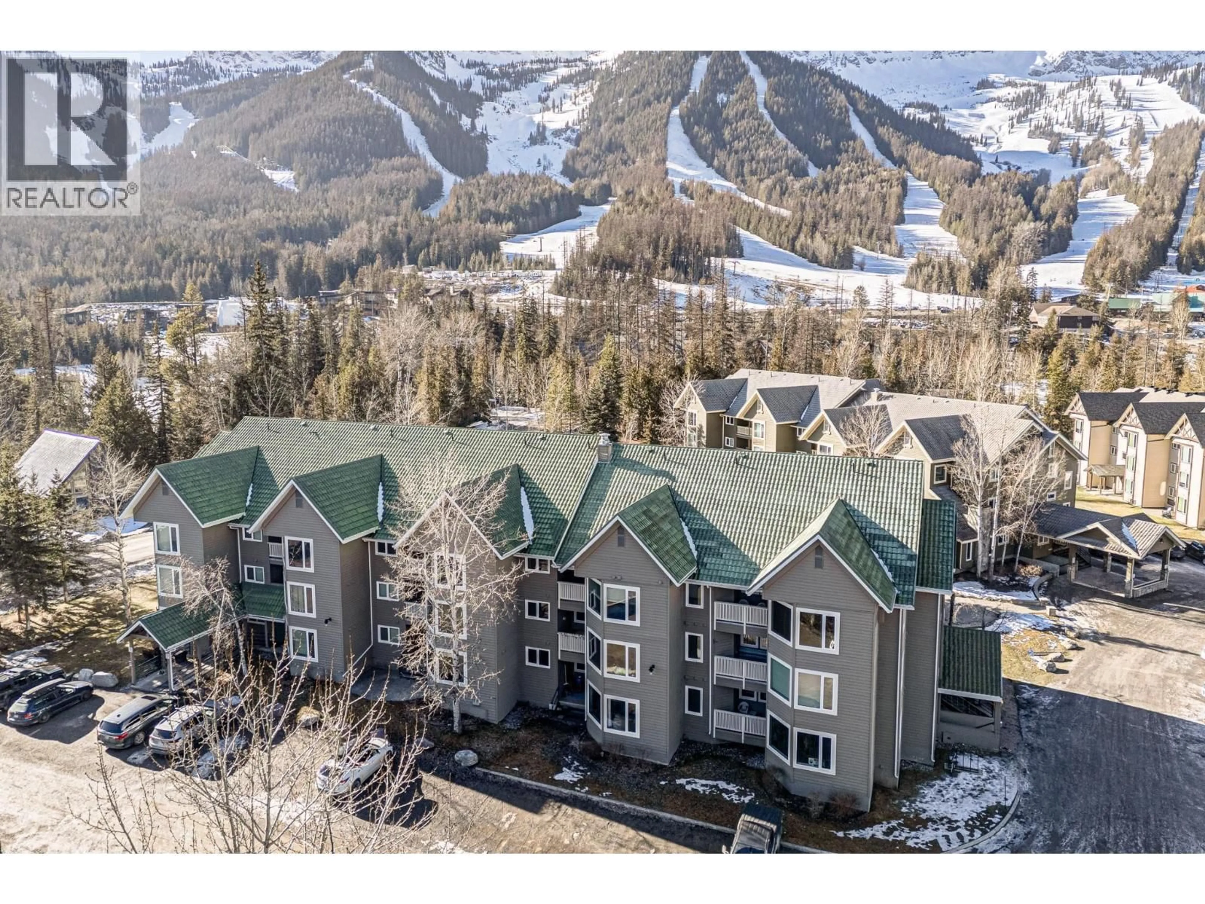 A pic from outside/outdoor area/front of a property/back of a property/a pic from drone, mountain view for 113 - 4559 TIMBERLINE CRESCENT, Fernie British Columbia V0B1M6