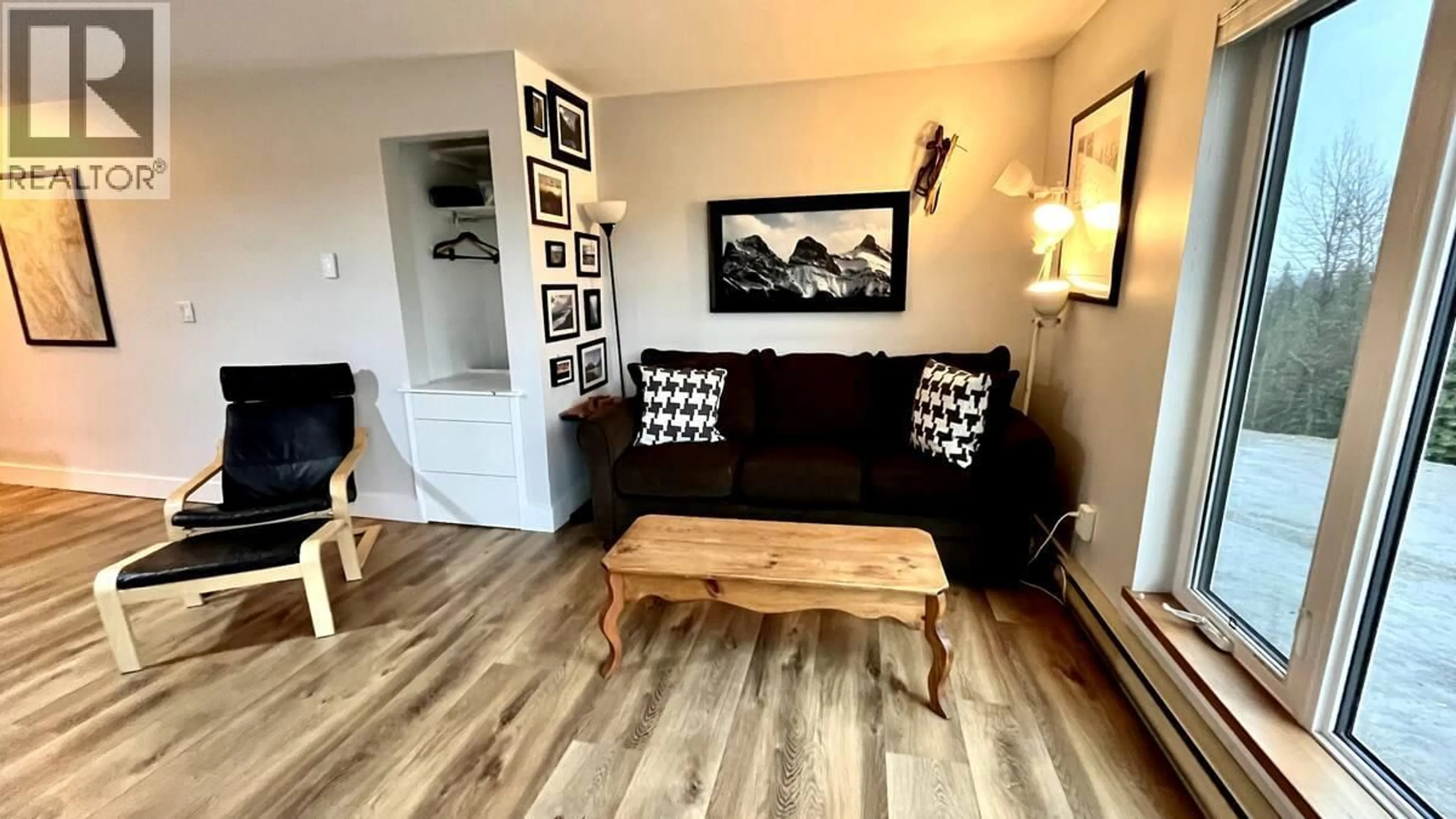 Living room with furniture, wood/laminate floor for 113 - 4559 TIMBERLINE CRESCENT, Fernie British Columbia V0B1M6