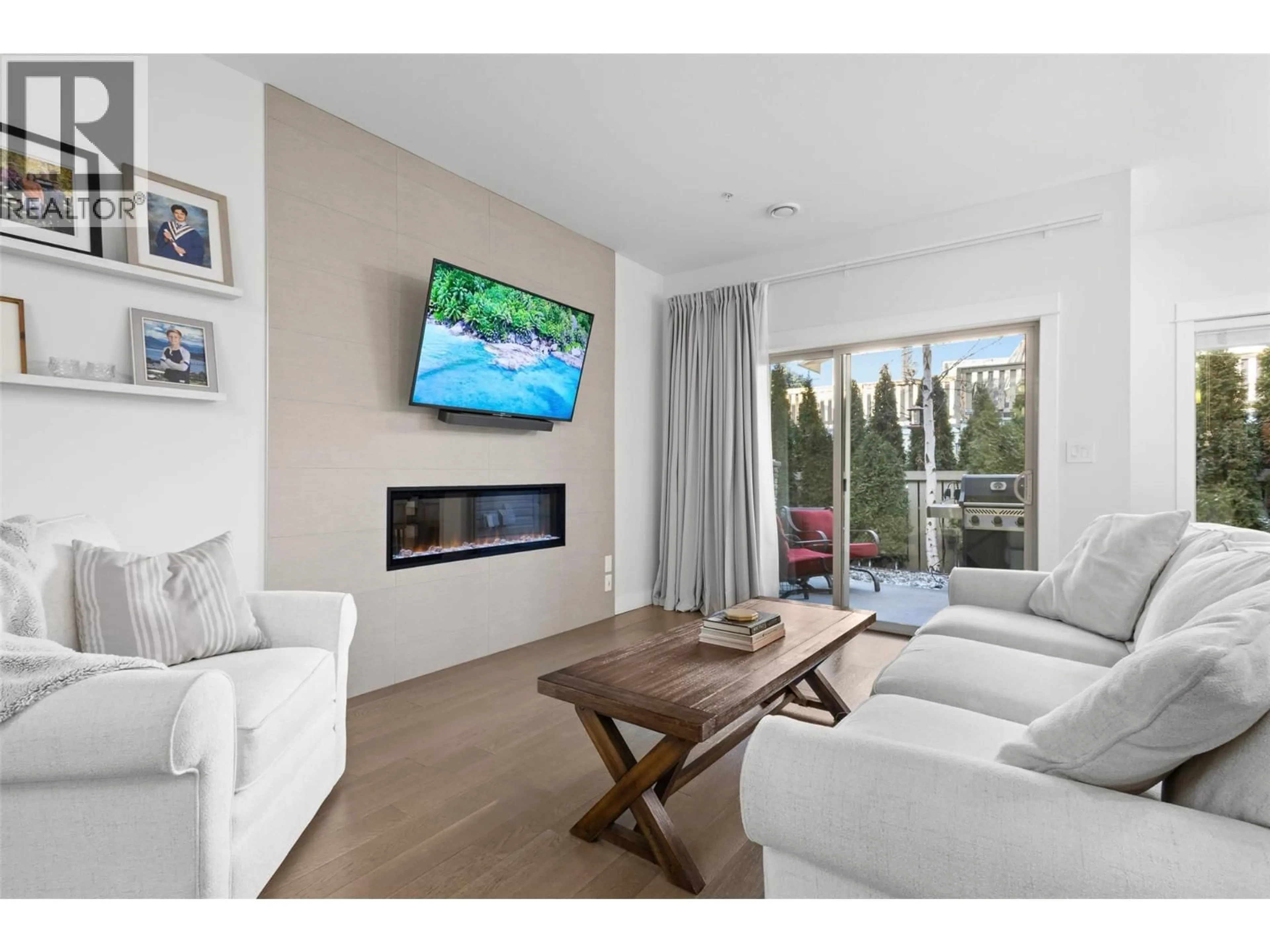 Living room with furniture, wood/laminate floor for 202 - 9563 JENSEN ROAD, Lake Country British Columbia V4V1S6