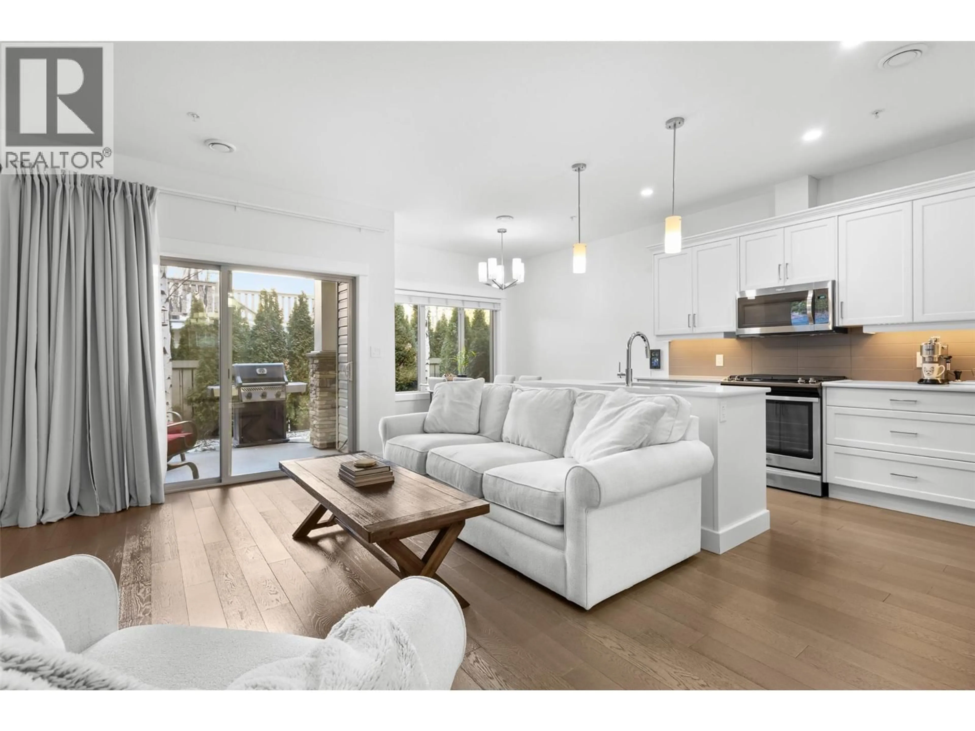 Living room with furniture, wood/laminate floor for 202 - 9563 JENSEN ROAD, Lake Country British Columbia V4V1S6