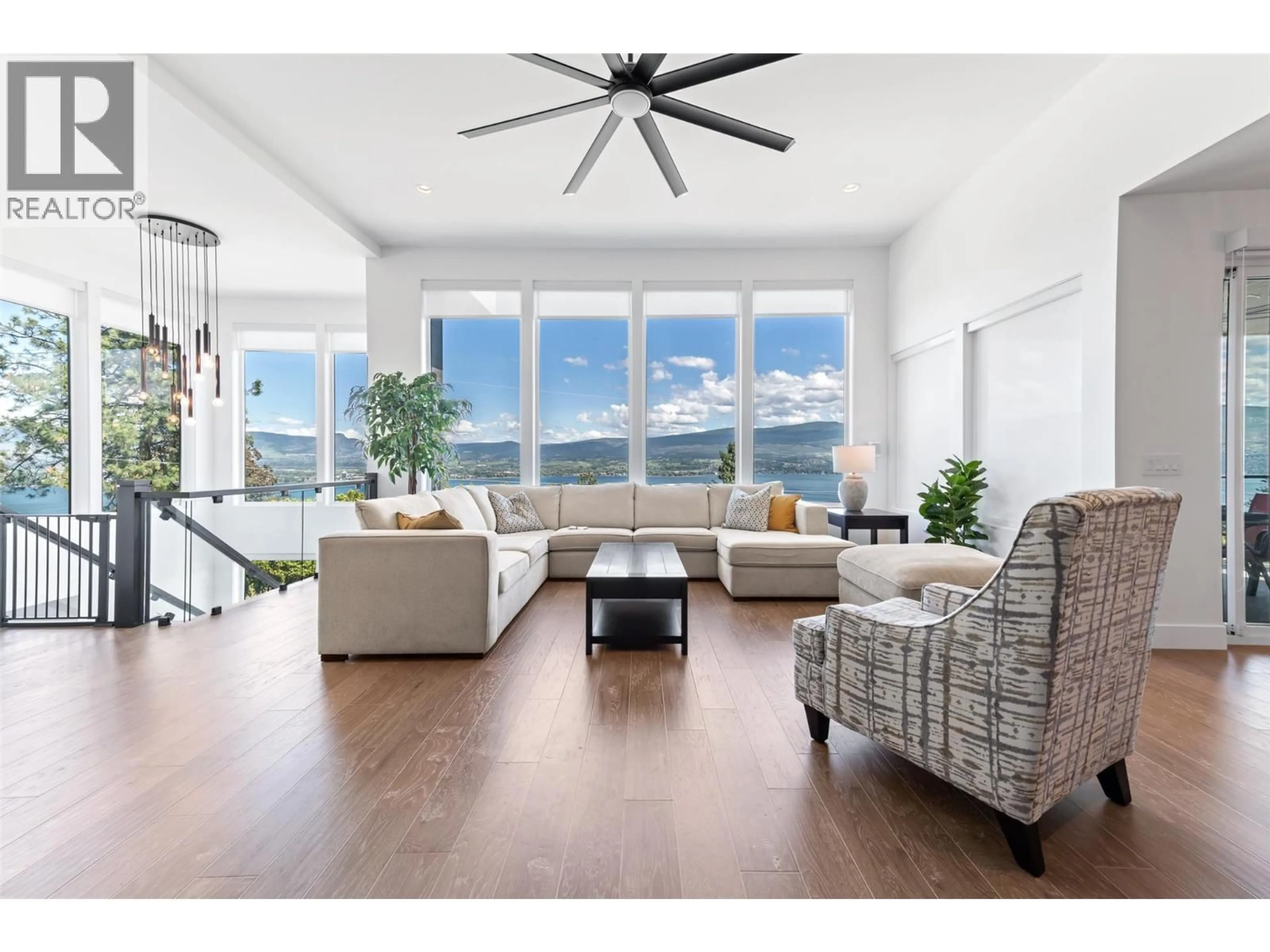 Living room with furniture, wood/laminate floor for 2672 LAKERIDGE ROAD, West Kelowna British Columbia V1Z1Y2