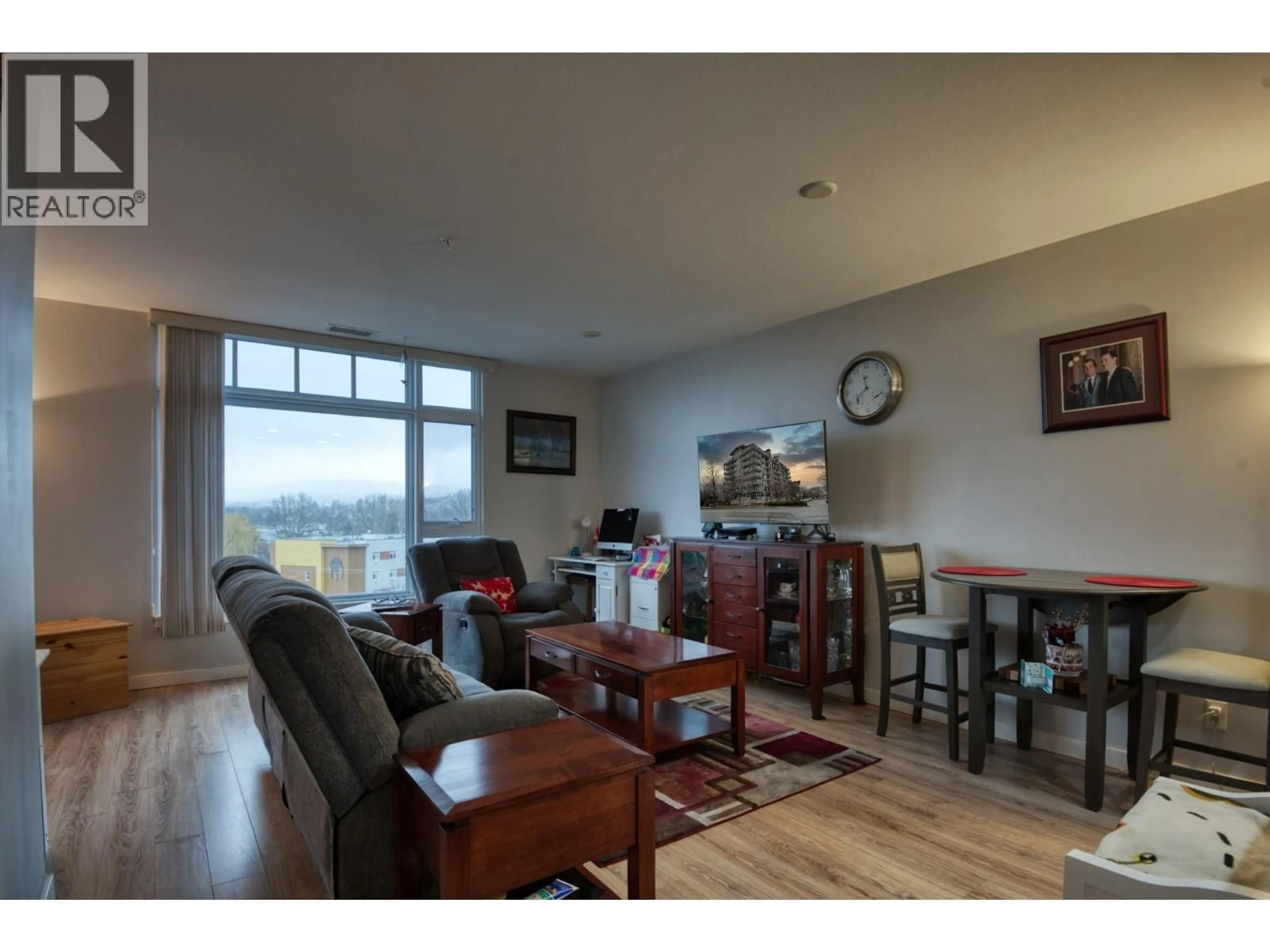 Living room with furniture, wood/laminate floor for 608 - 3301 SKAHA LAKE ROAD, Penticton British Columbia V2A6G6