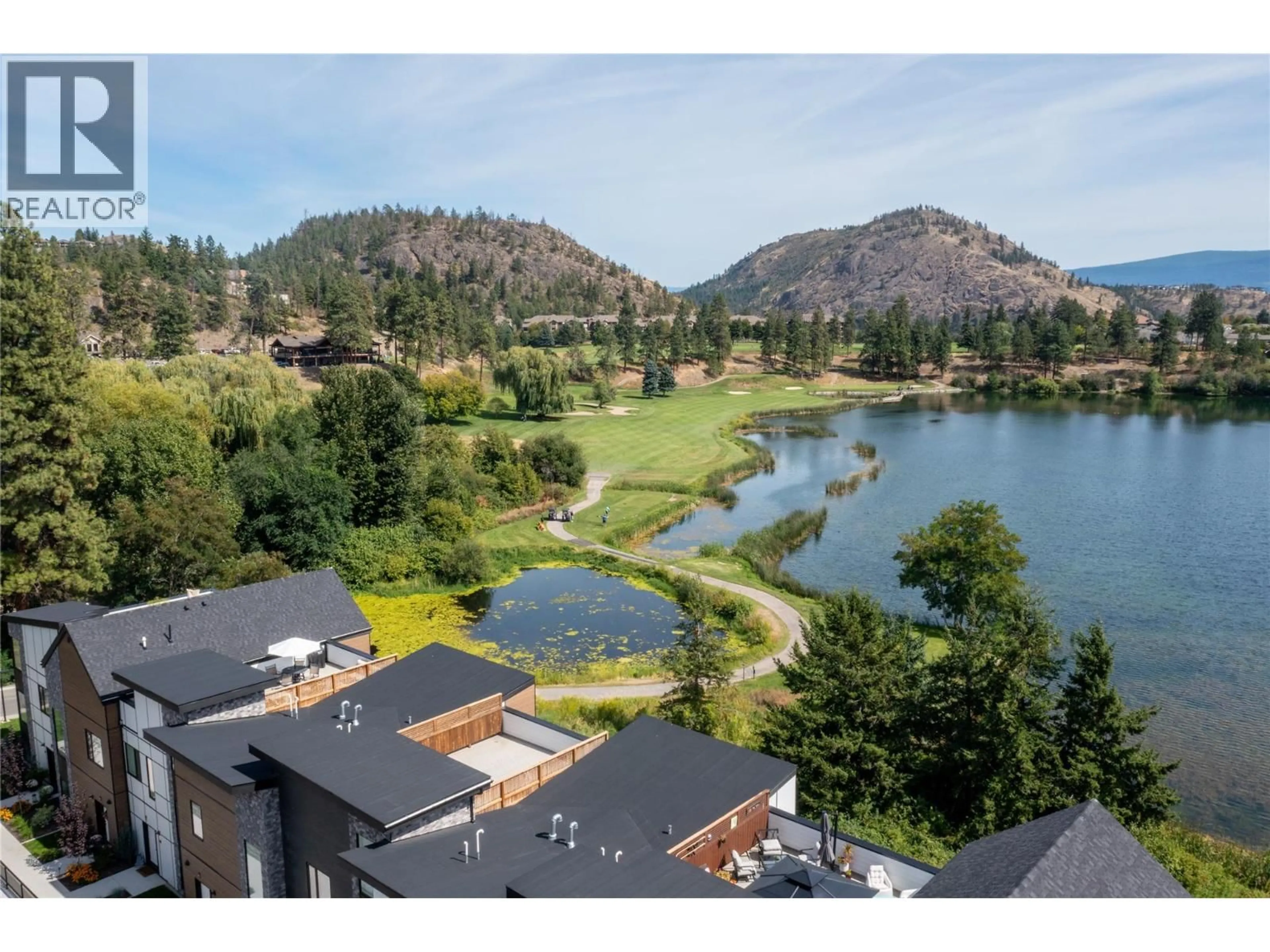 A pic from outside/outdoor area/front of a property/back of a property/a pic from drone, water/lake/river/ocean view for 502 - 2735 SHANNON LAKE ROAD, West Kelowna British Columbia V4T1V6