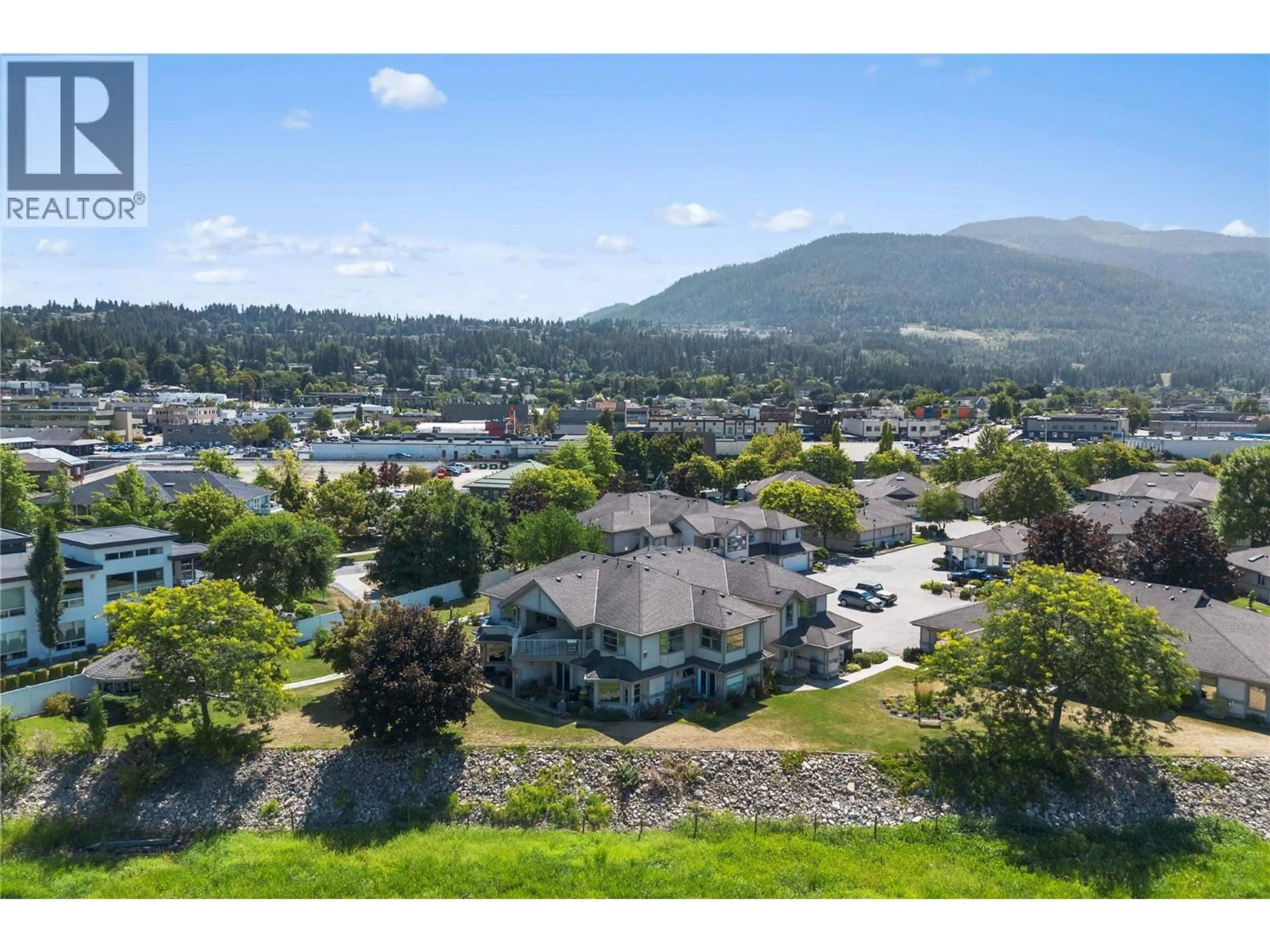 A pic from outside/outdoor area/front of a property/back of a property/a pic from drone, mountain view for 2 - 111 HARBOURFRONT DRIVE NORTHWEST, Salmon Arm British Columbia V1E1A3