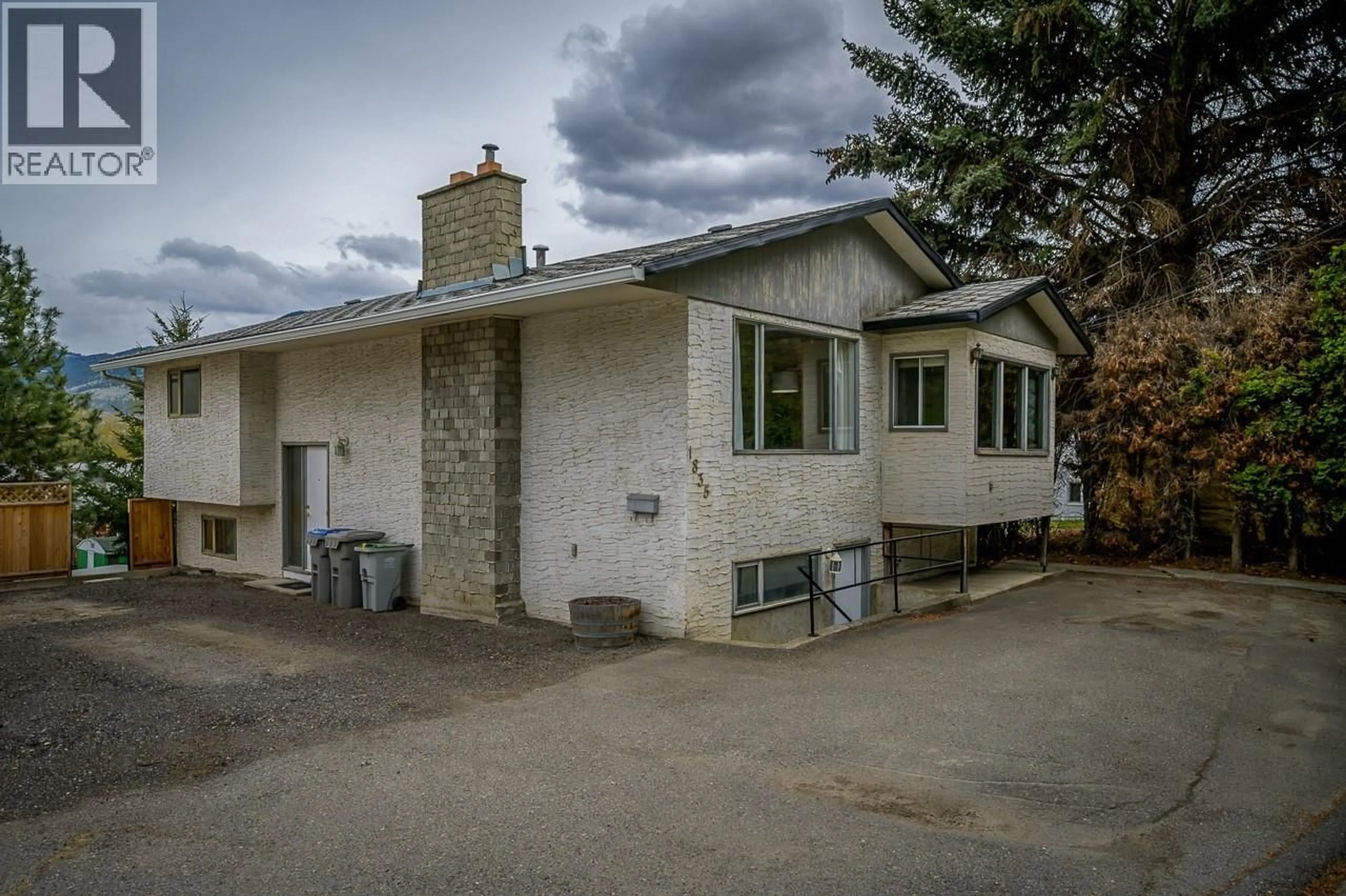 A pic from outside/outdoor area/front of a property/back of a property/a pic from drone, street for 1835 WESTSYDE ROAD, Kamloops British Columbia V2B7B9