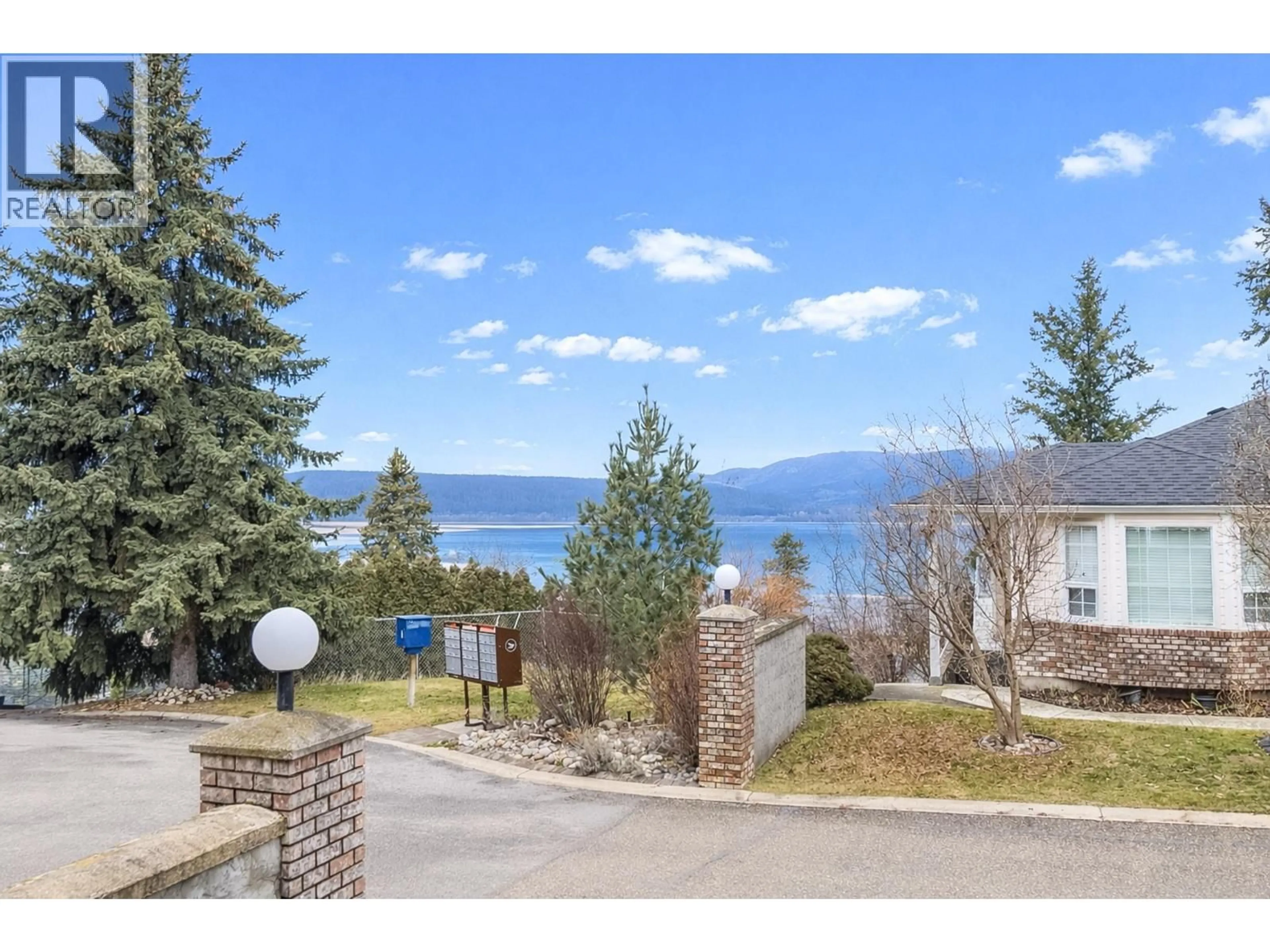A pic from outside/outdoor area/front of a property/back of a property/a pic from drone, water/lake/river/ocean view for 2 - 1120 12 STREET NORTHEAST, Salmon Arm British Columbia V1E1B8