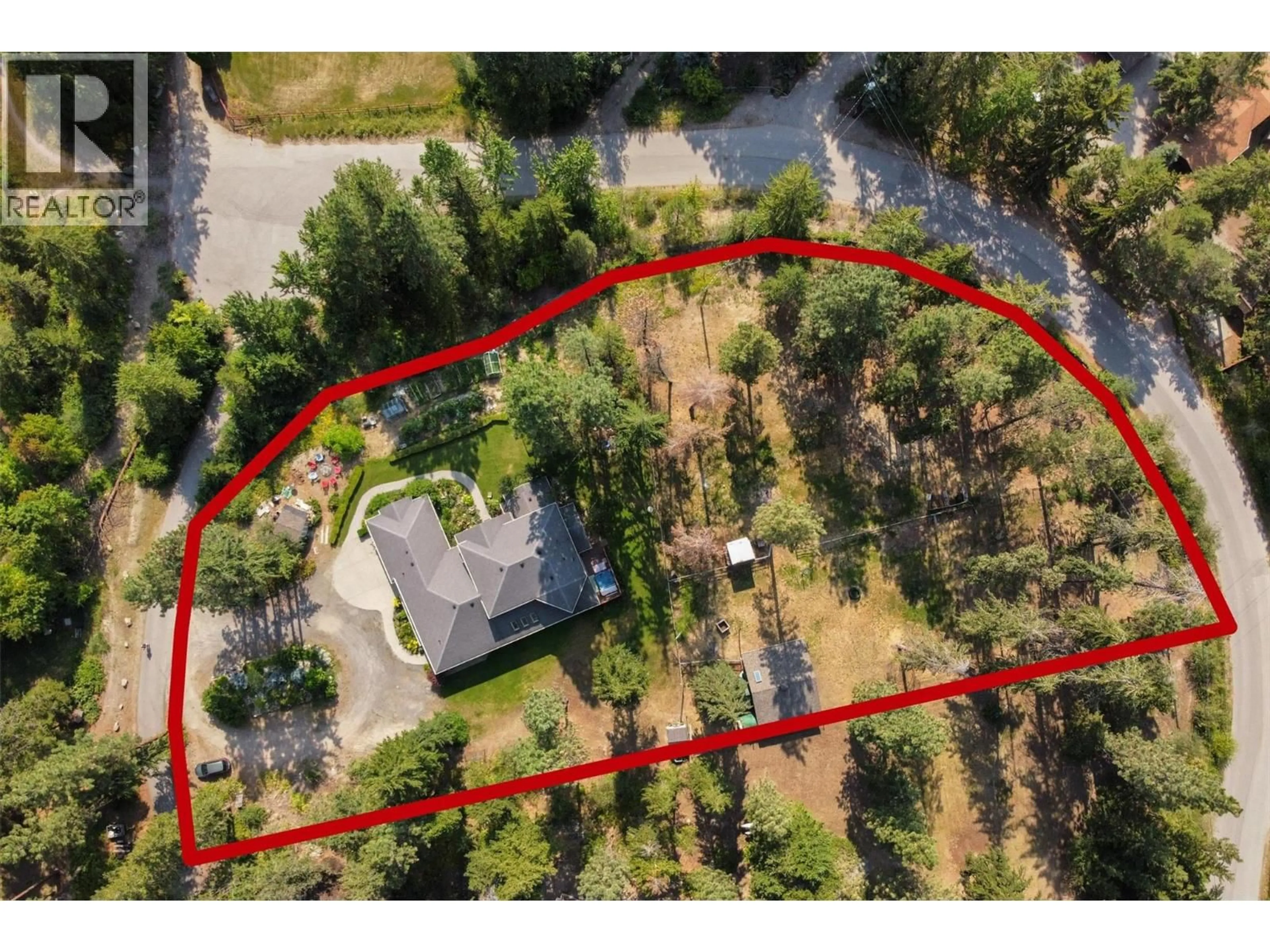 A pic from outside/outdoor area/front of a property/back of a property/a pic from drone, forest/trees view for 3605 LUXMOORE ROAD, Kelowna British Columbia V1W4C7