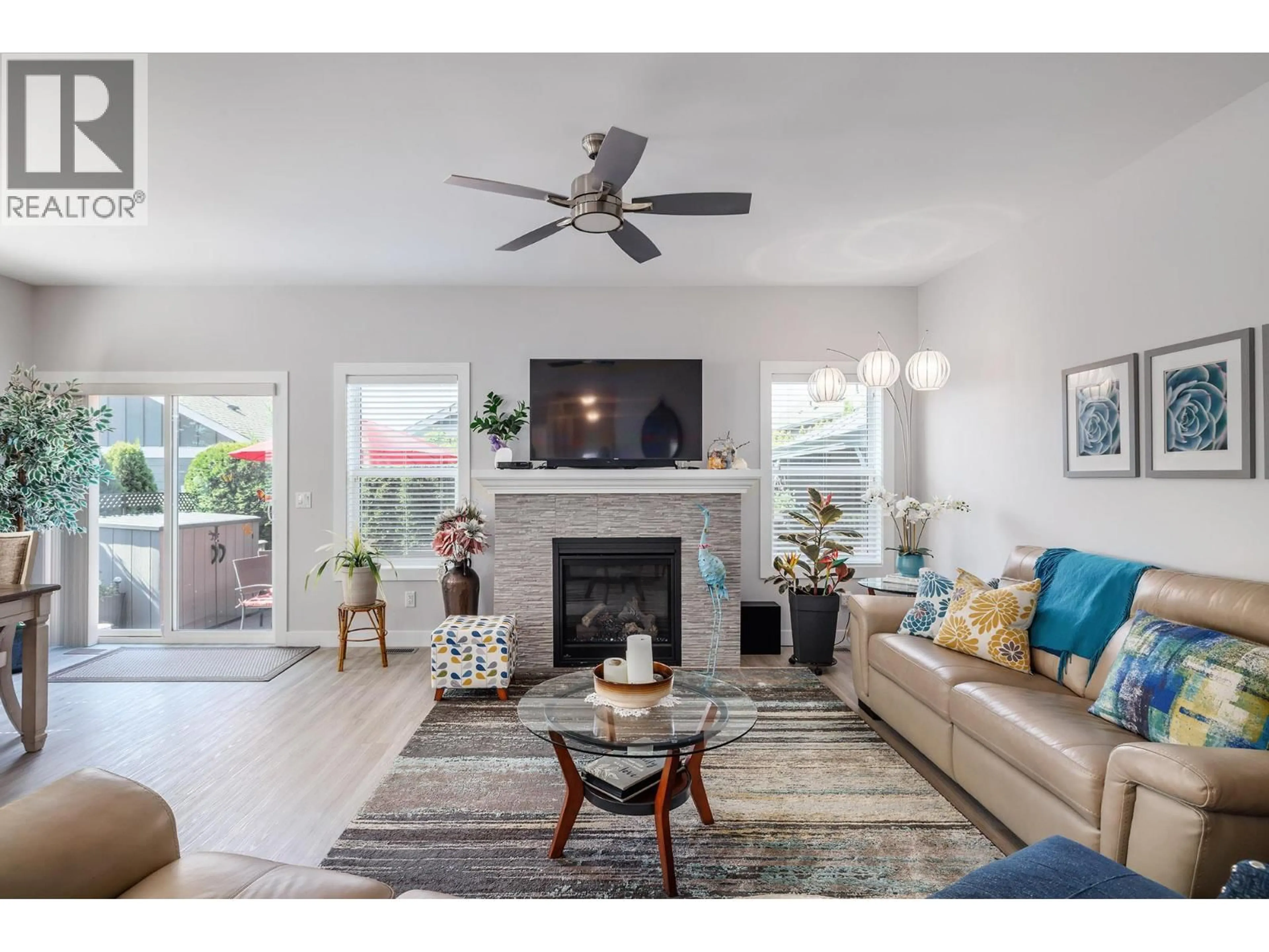 Living room with furniture, wood/laminate floor for 3339 MIMOSA DRIVE, Westbank British Columbia V4T3A5