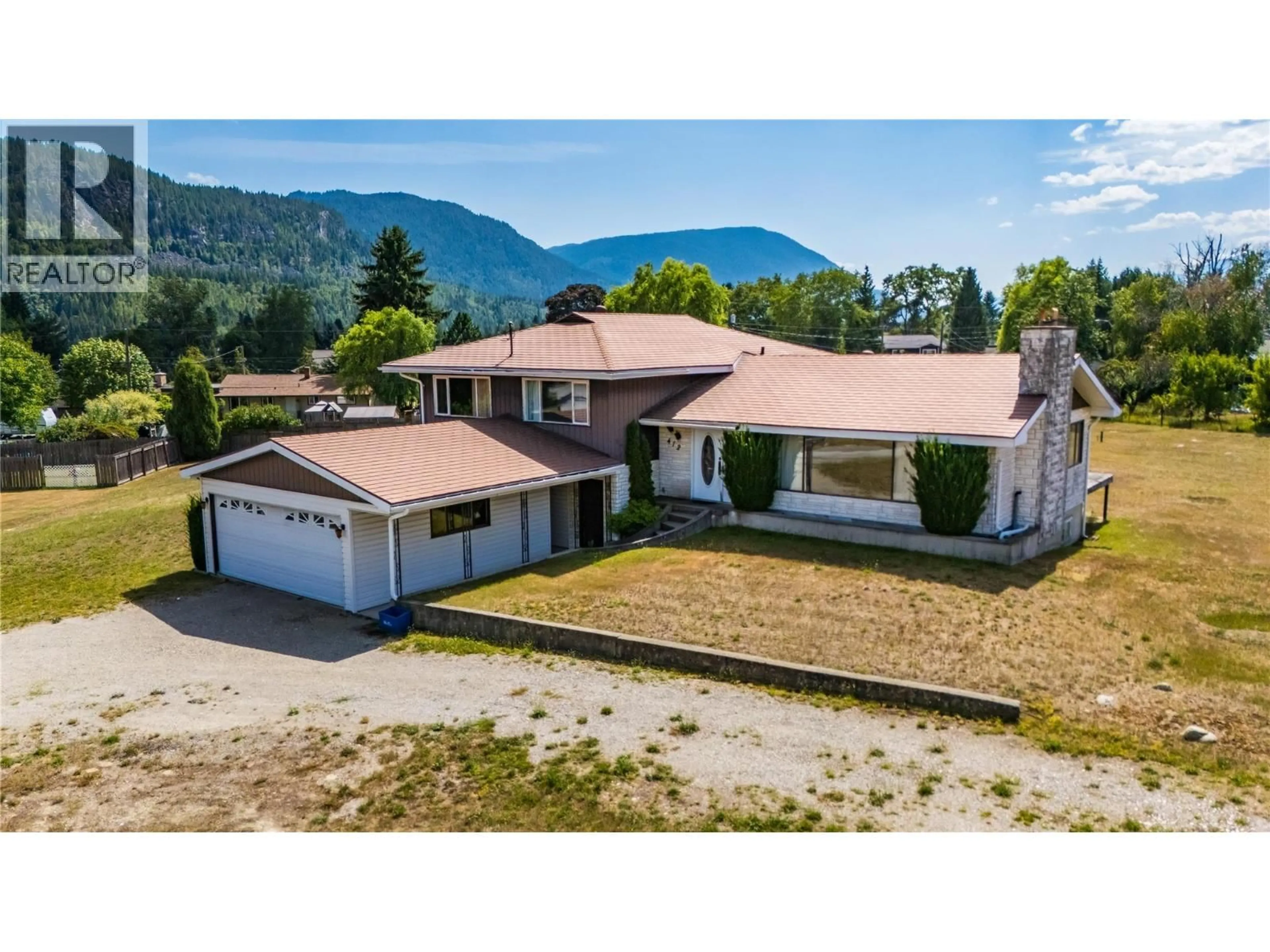 A pic from outside/outdoor area/front of a property/back of a property/a pic from drone, mountain view for 412 104TH STREET, Castlegar British Columbia V1N3G5