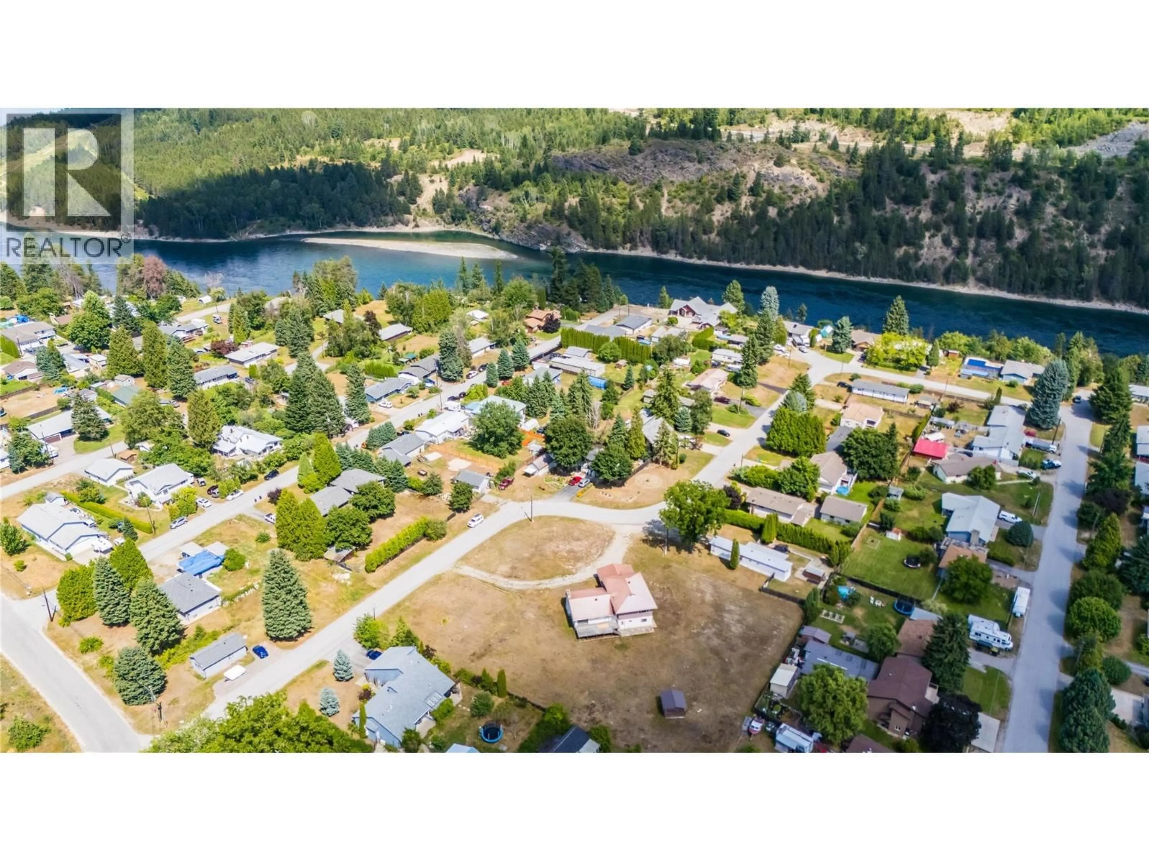 A pic from outside/outdoor area/front of a property/back of a property/a pic from drone, water/lake/river/ocean view for 412 104TH STREET, Castlegar British Columbia V1N3G5