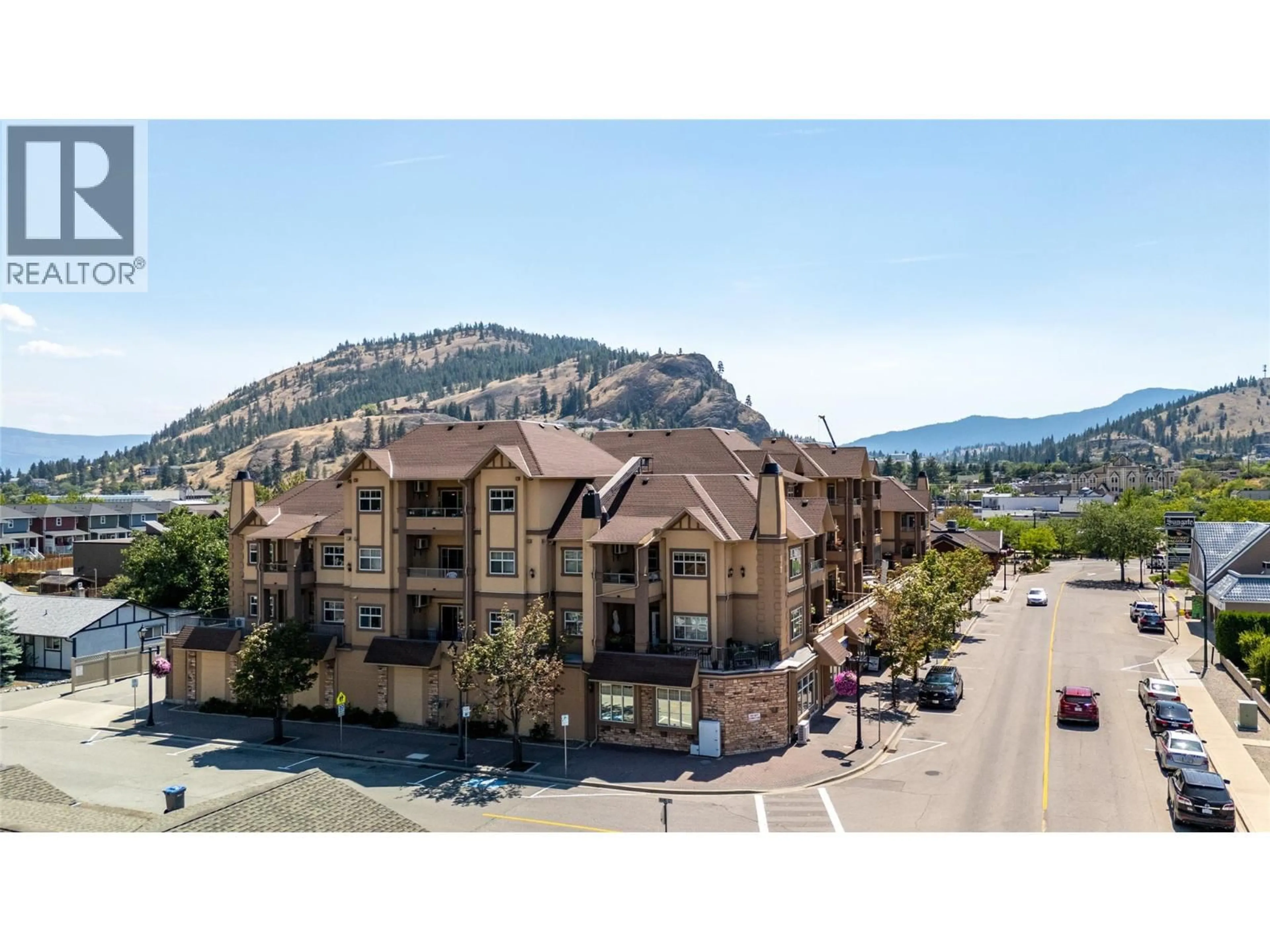 A pic from outside/outdoor area/front of a property/back of a property/a pic from drone, mountain view for 206 - 13615 VICTORIA ROAD NORTH, Summerland British Columbia V0H1Z5