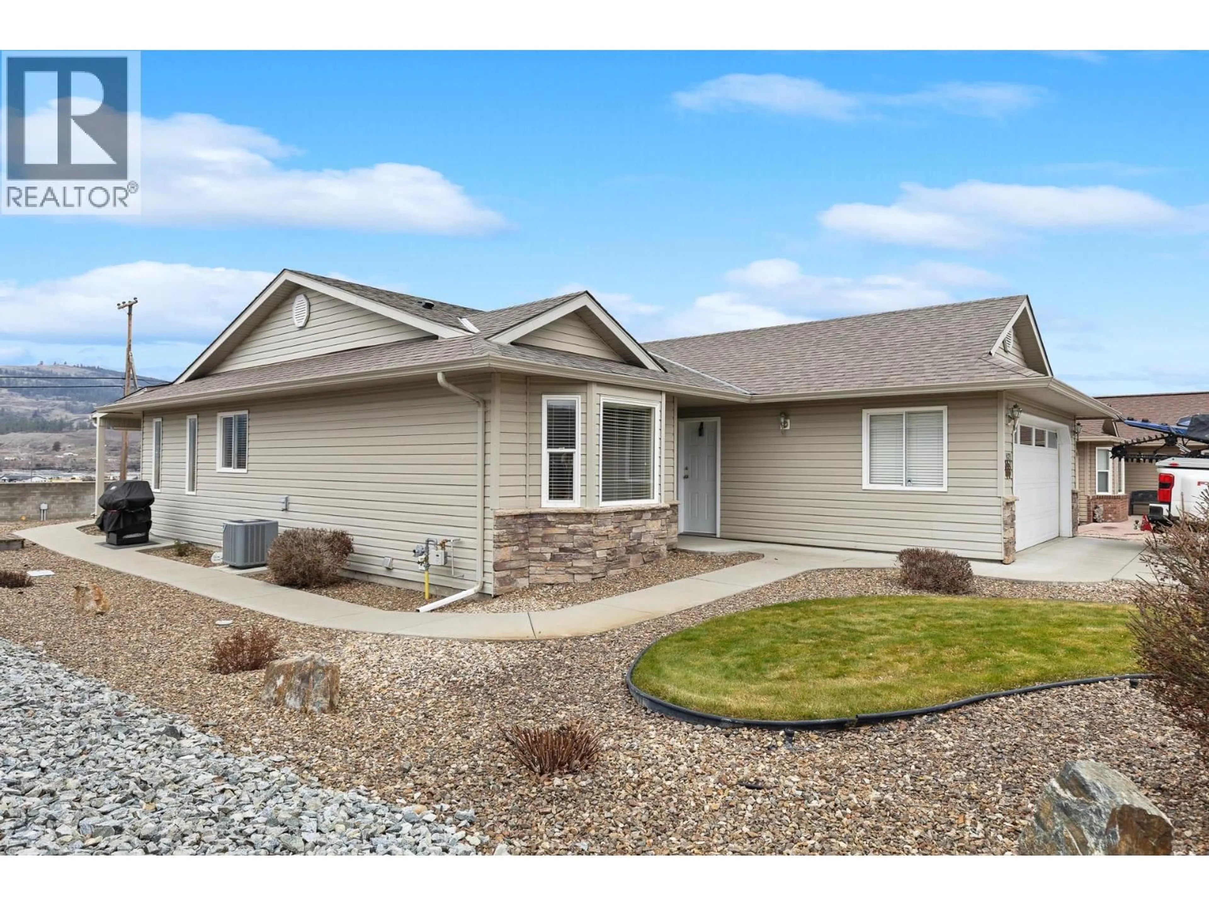 Home with vinyl exterior material, street for 1129 1 ST. N STREET, Vernon British Columbia V1H1Z1